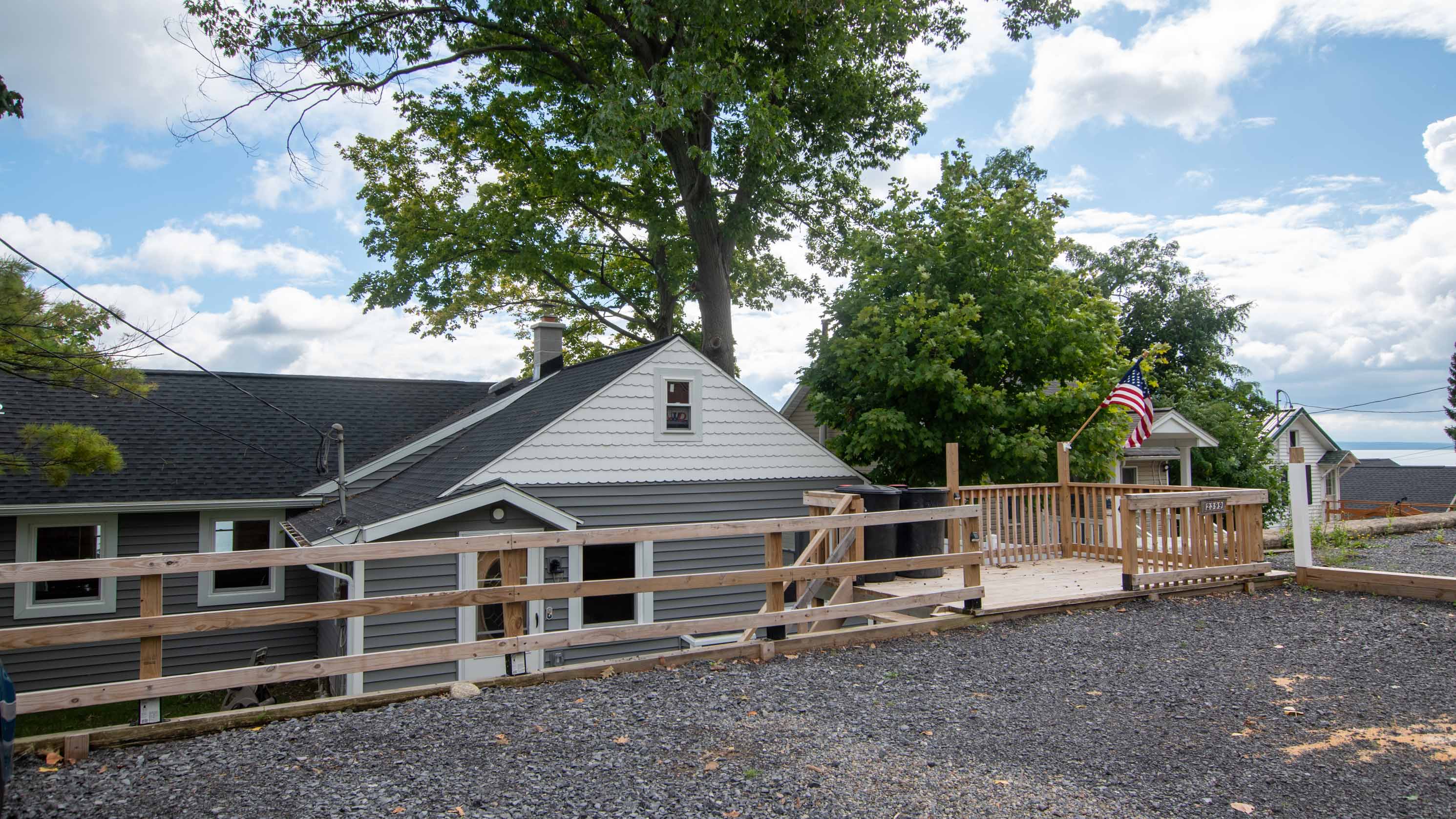 Elevated outdoor space with lake views and room to gather and relax