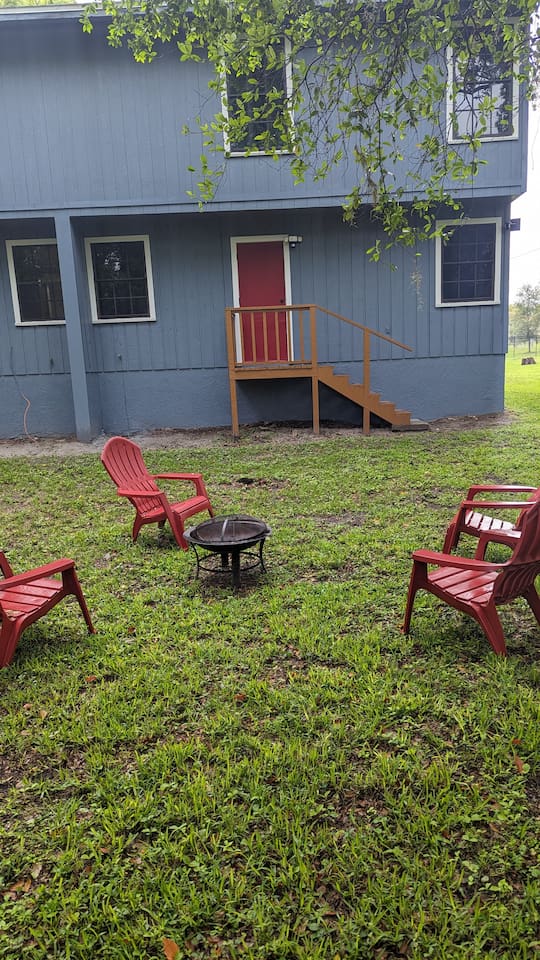 Backyard with seating and a firepit