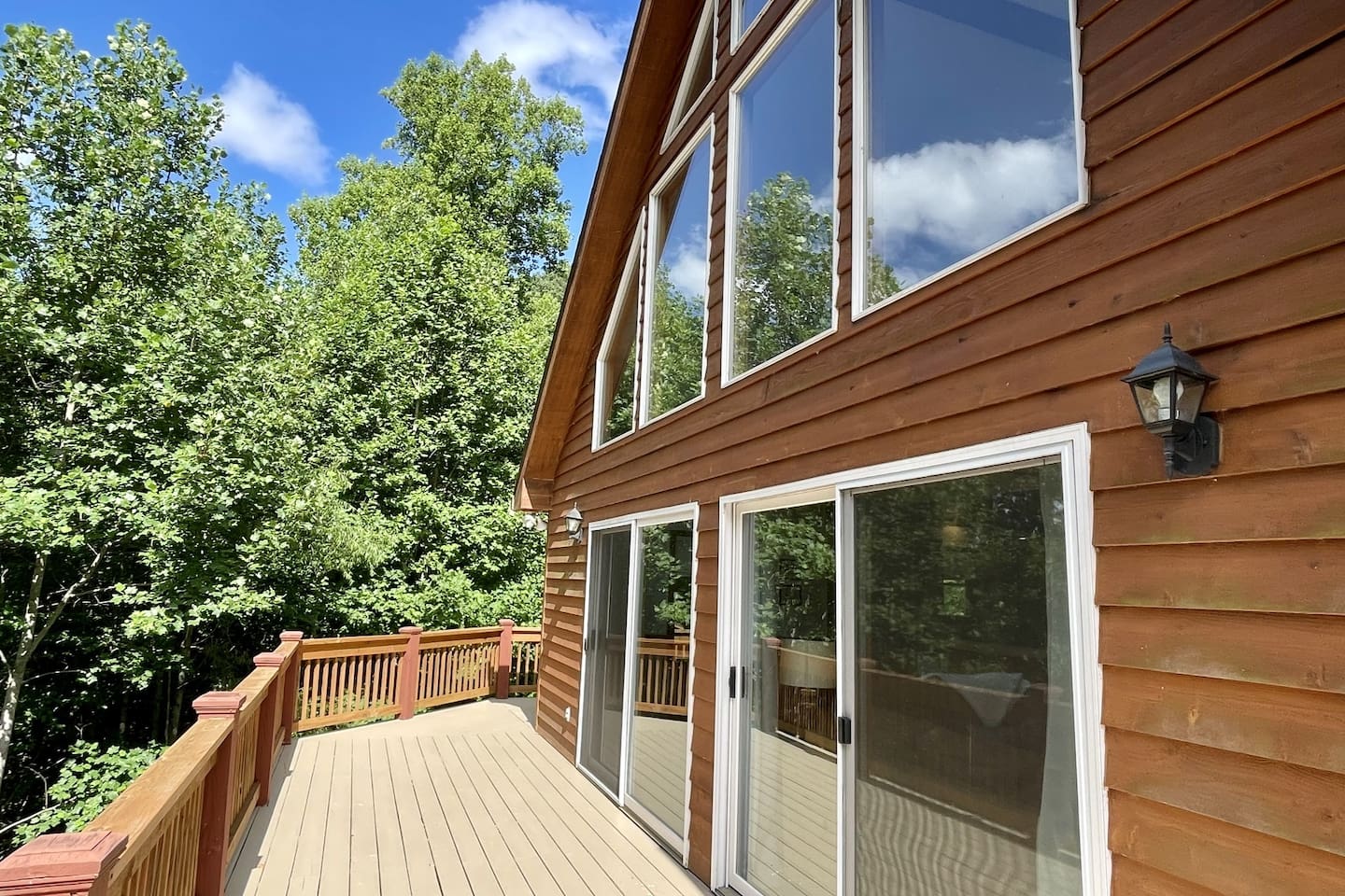 There are screened sliding doors that open to the dining area from the picture perfect front porch