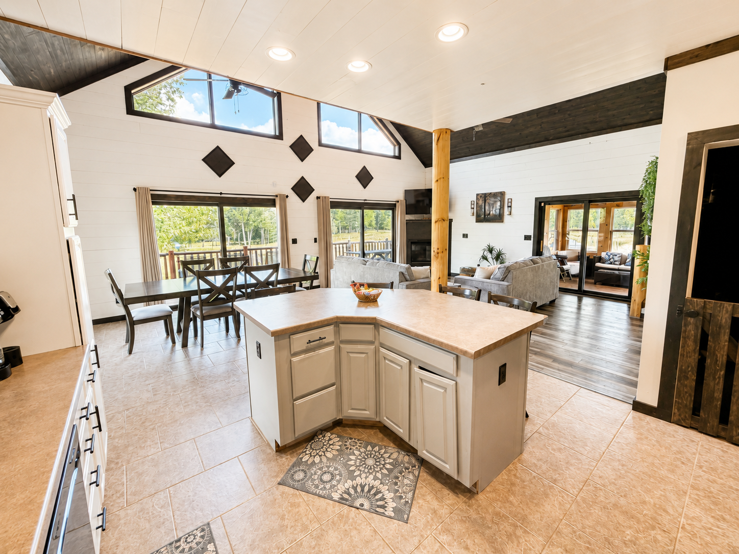 Open kitchen and dining area keeps everyone connected, with plenty of space for group meals, conversation and time together.
