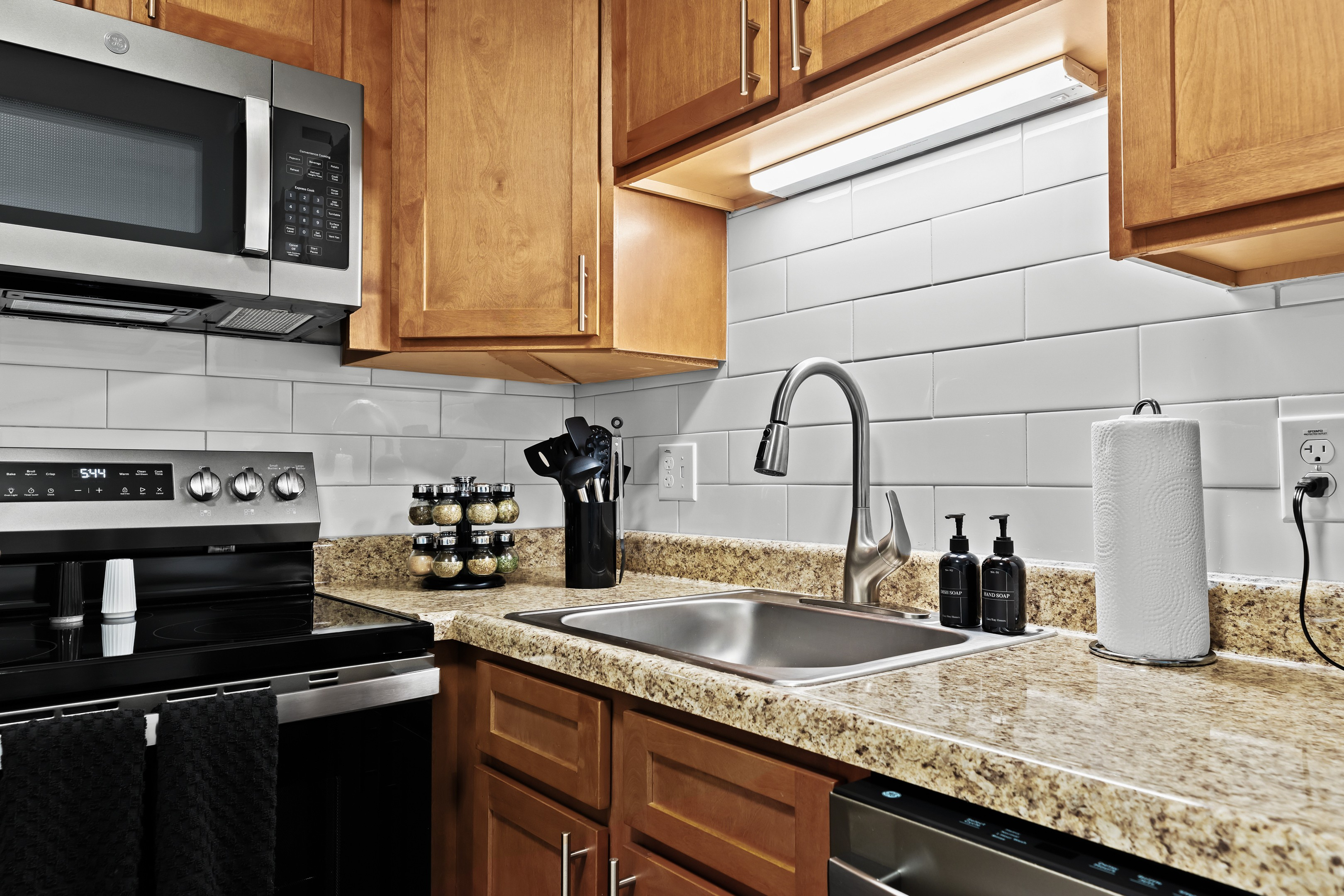 The kitchen includes all your basics: knives, spices, and utensils for hassle-free meal prep.