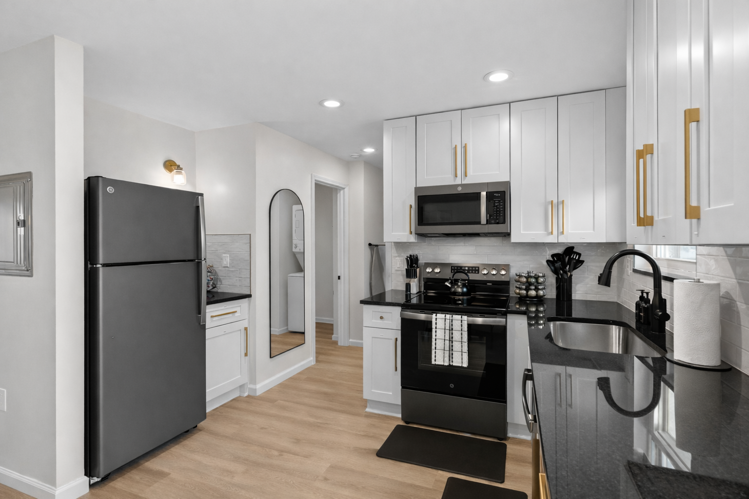 Bright, modern kitchen with sleek cabinetry, full-size appliances, and ample counter space—perfect for cooking, prepping meals, and everyday comfort.