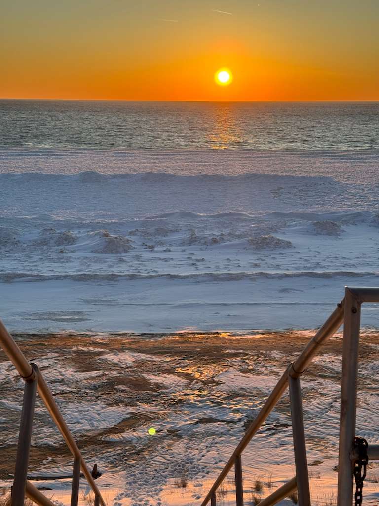 Secure metal stairs down to our 372' of beach