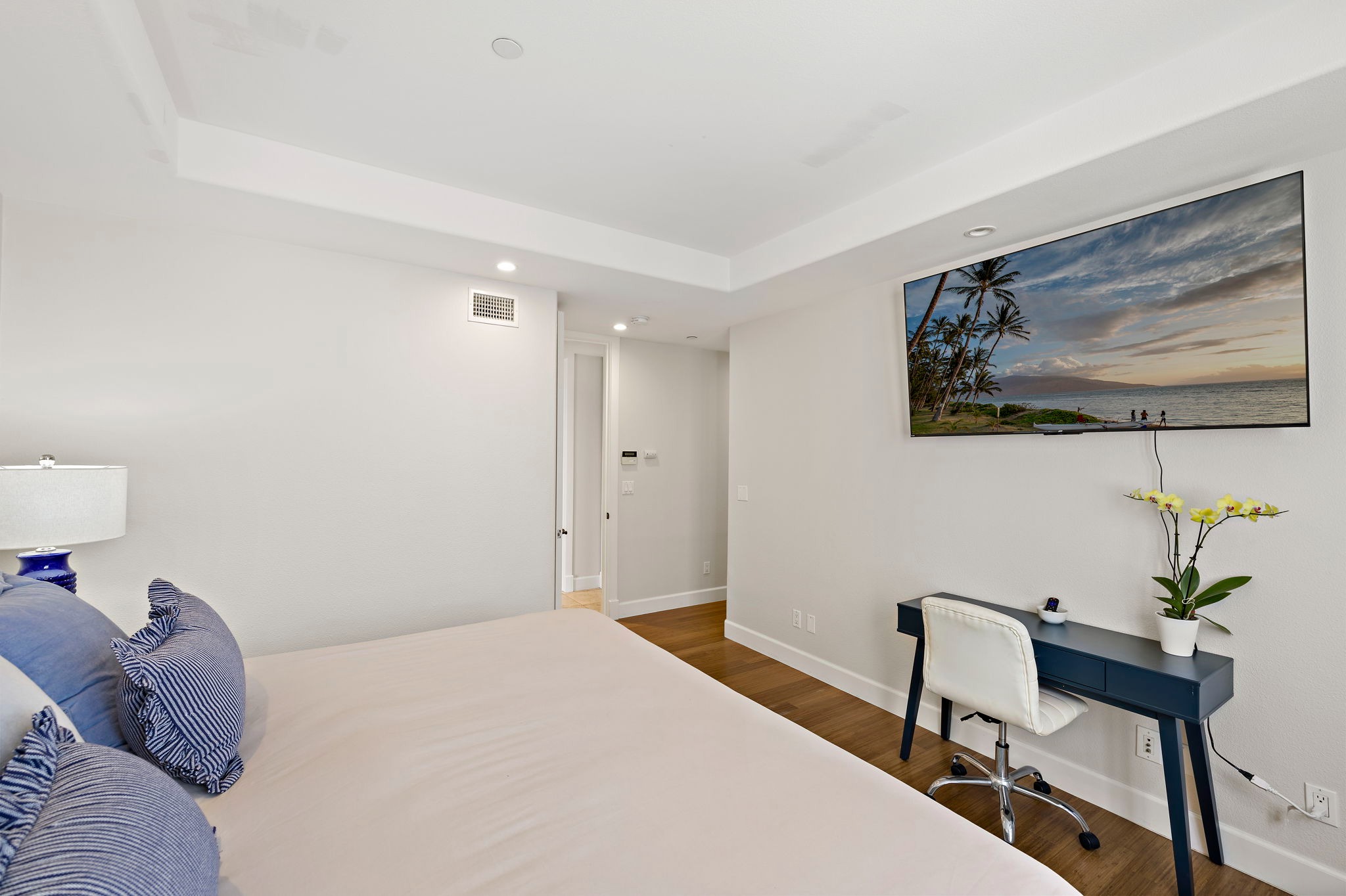 The primary bedroom also has a dedicated work space and a 65" TV with plenty of streaming channels for movie night or binge watching :)