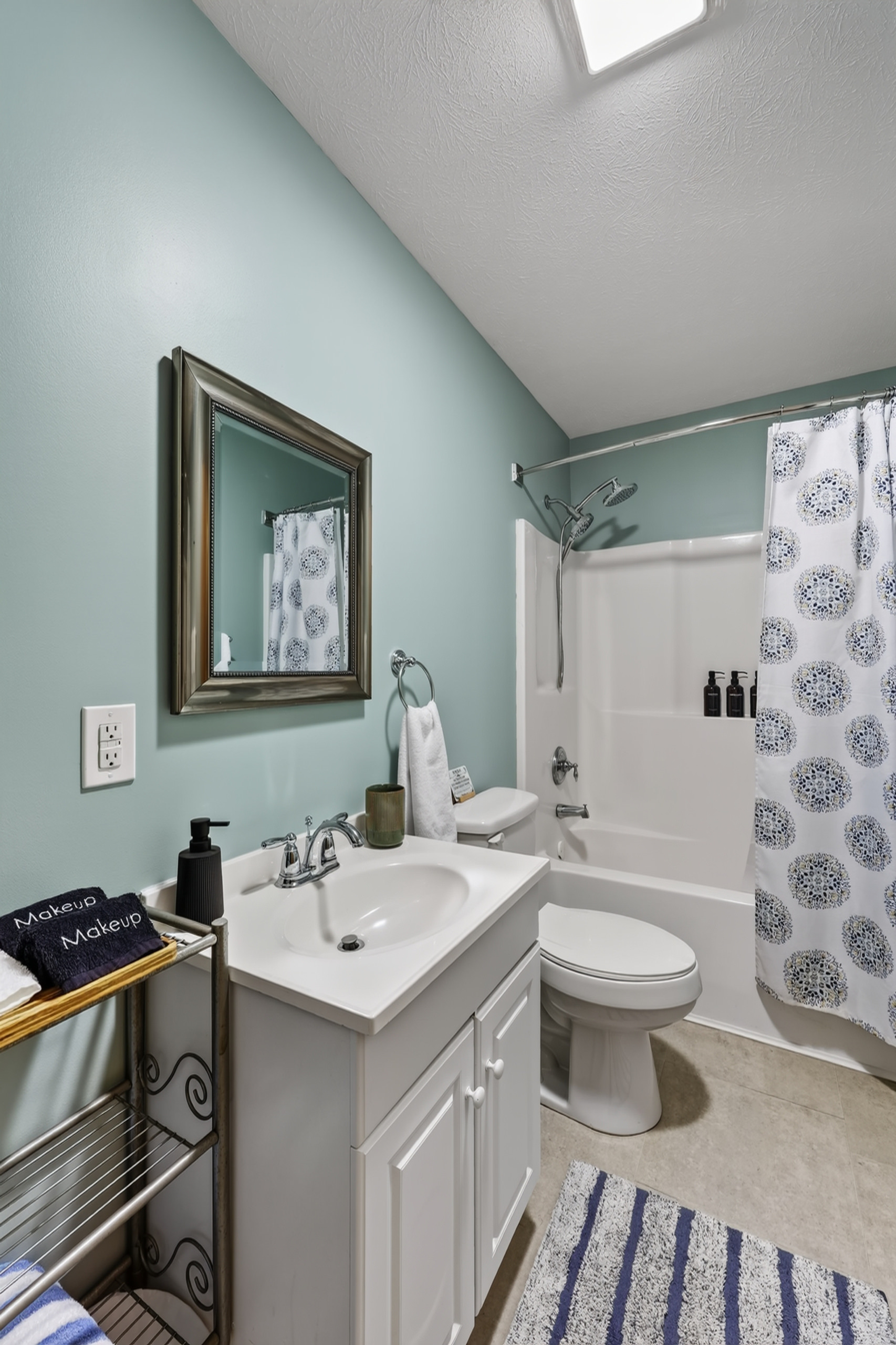 The main bathroom features a combo shower/tub with rain head and removable sprayer. We provide towels, linens, as well as basic soaps and essentials.