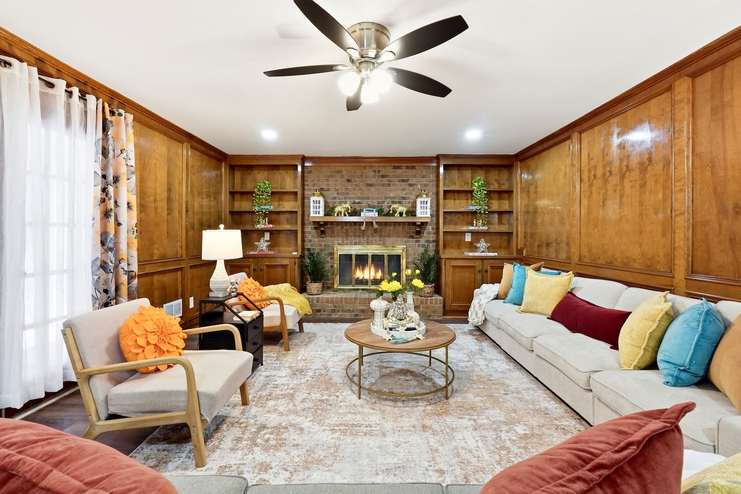 Enjoy a warm and inviting space featuring two comfortable couches and a charming fireplace perfect for relaxing, chatting, or unwinding after a long day.