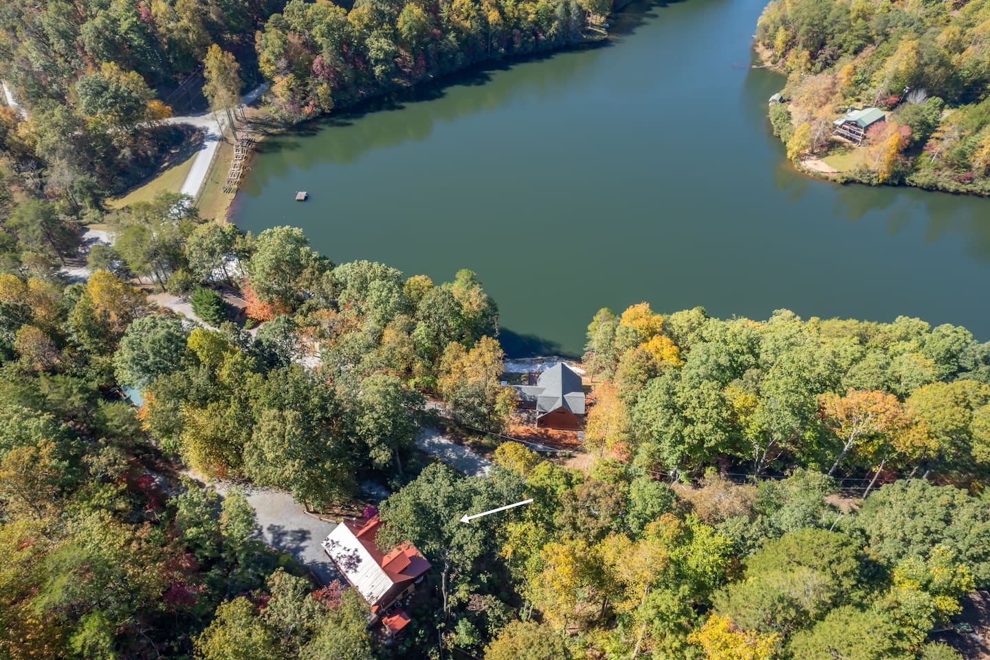Aerial view of cabin and lake