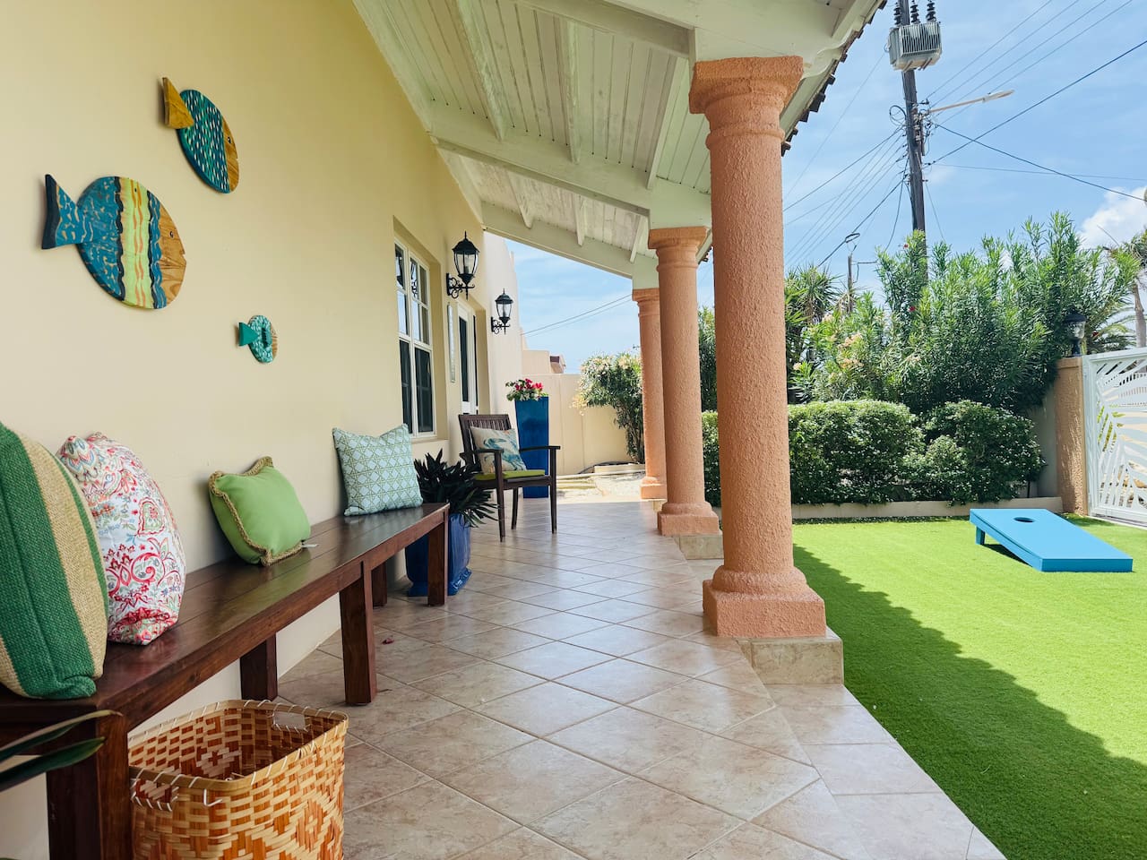 Large Jenga and Cornhole in the from yard