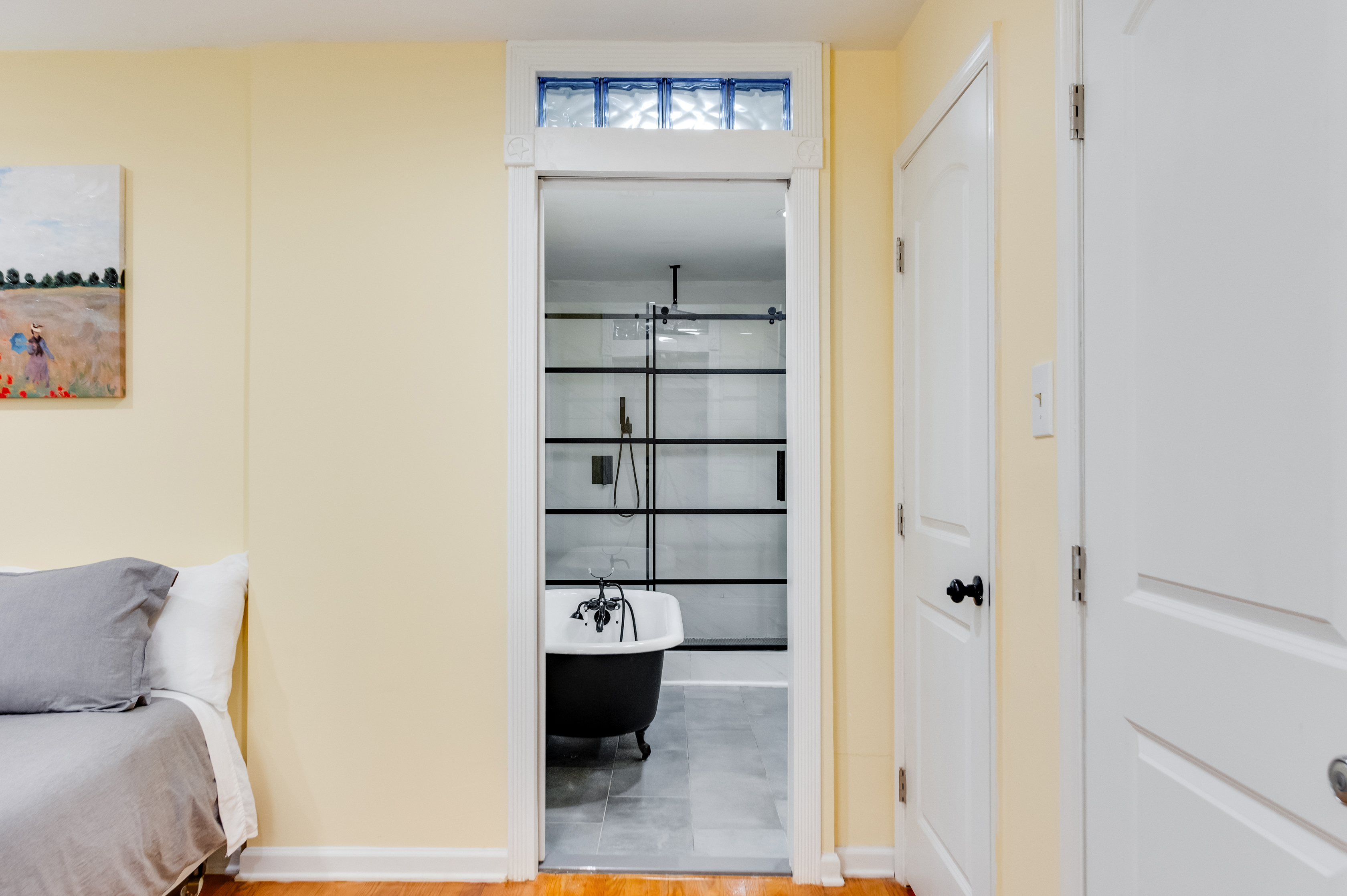 Ensuite Full Bathroom 2: Enjoy a chic clawfoot tub and modern glass shower in stylish serenity!