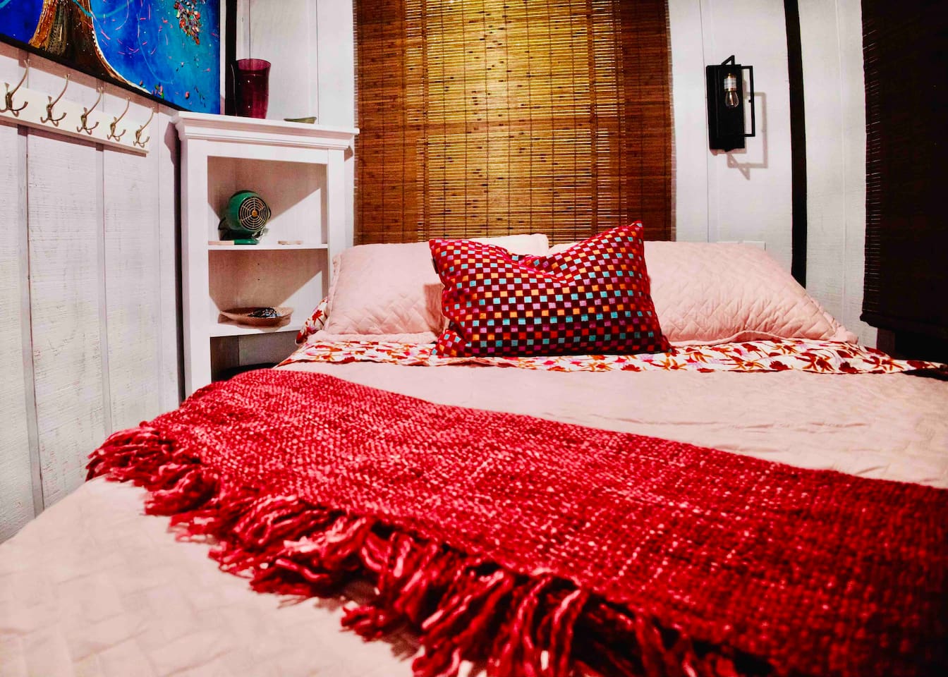 Don’t let the size of a shipping container fool you.  A queen size bed with bedside light, corner shelving, clothing hooks, books, and a bedside fan will provide you with a restful night.  