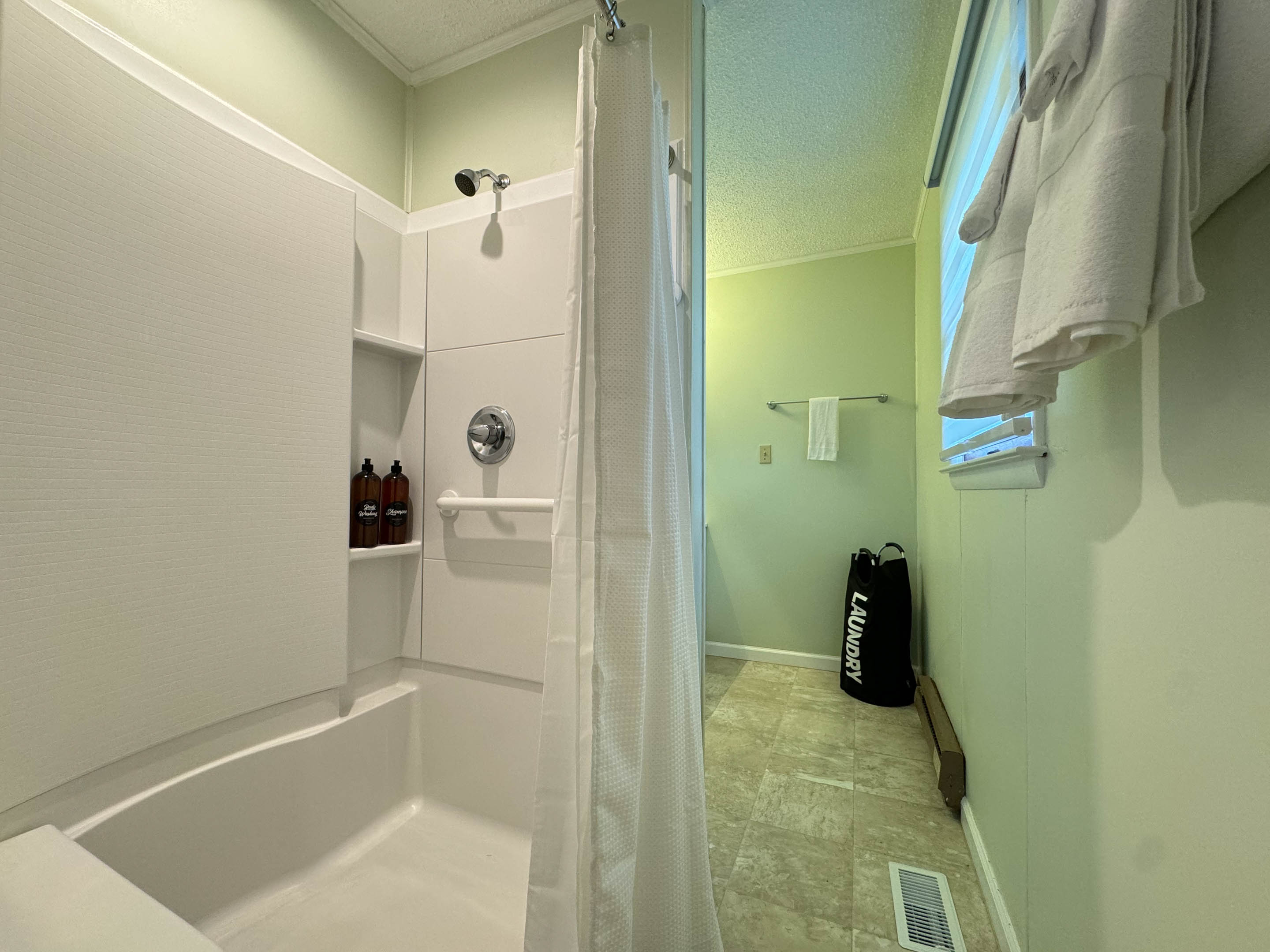 The master ensuite bathroom features an easy access shower complete with a shower chair and grab bar!
