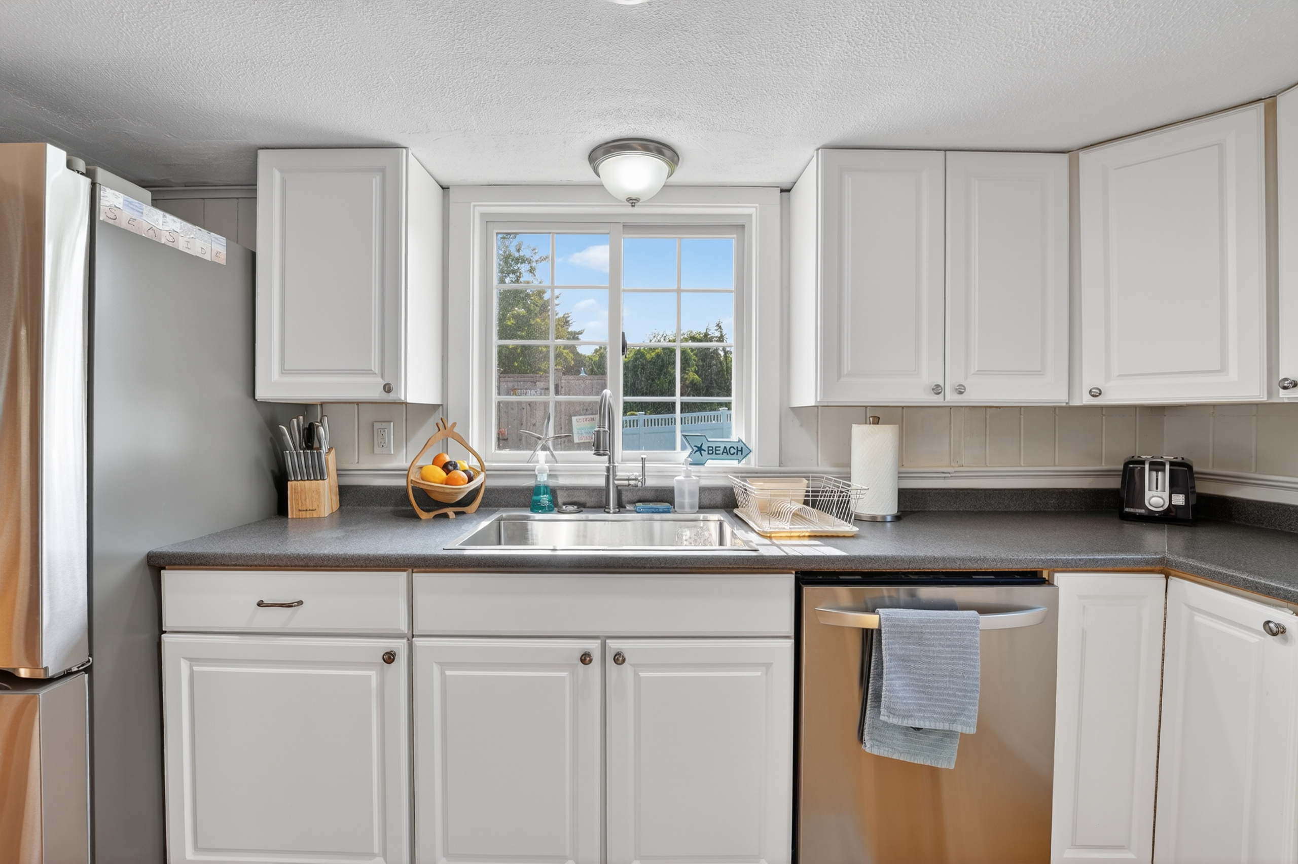 Bright, fully equipped kitchen with ample counter space, modern appliances, and everything you need to prepare meals during your stay.