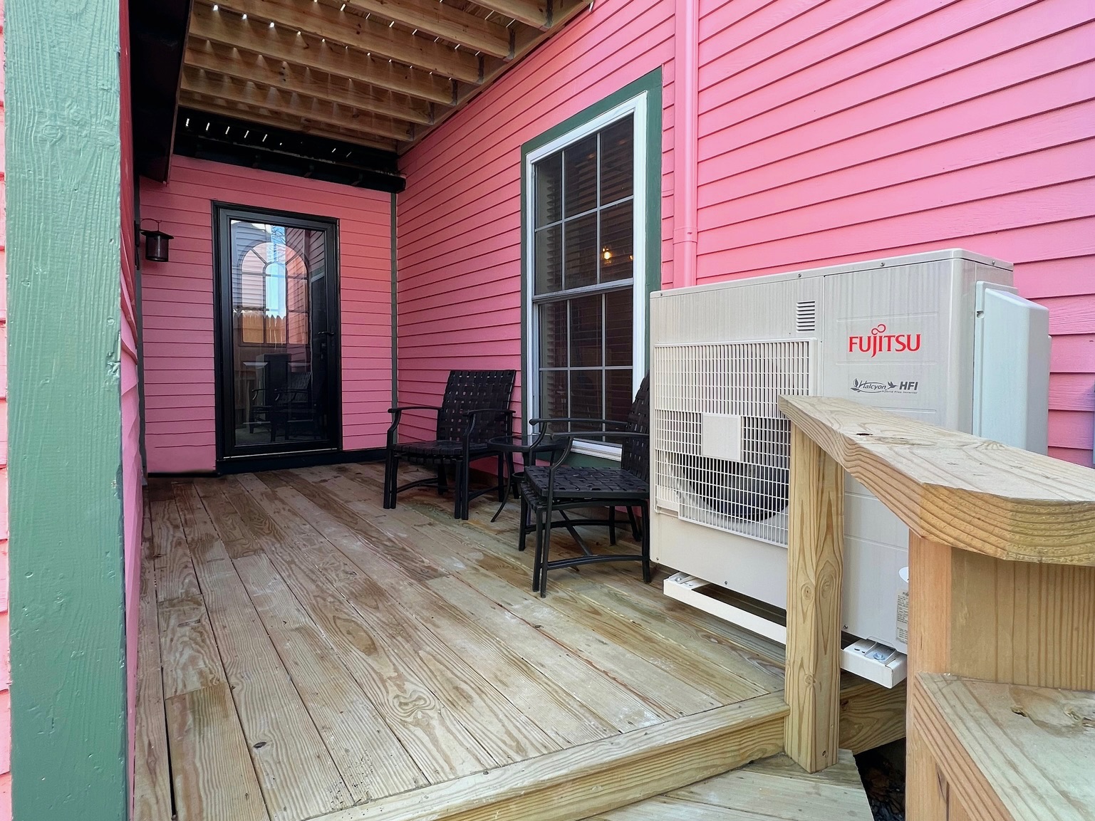 The private entrance features a small deck with seating for two to enjoy the fresh Maine air.