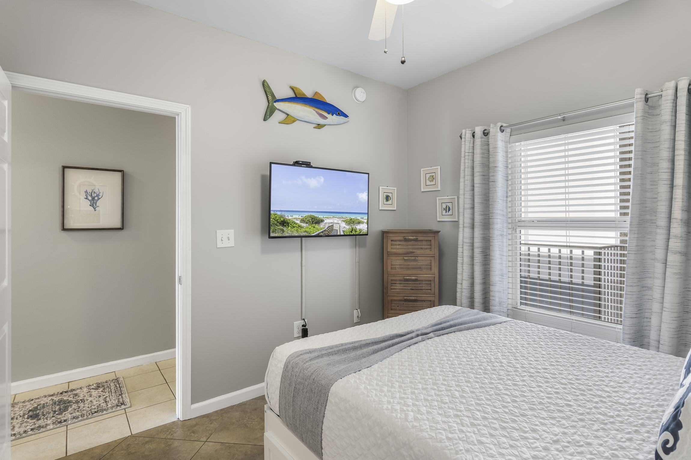 Guest Bedroom has Queen + Twin Trundle Bed, Smart TV, attached closet, and attached bathroom with shower/tub combo