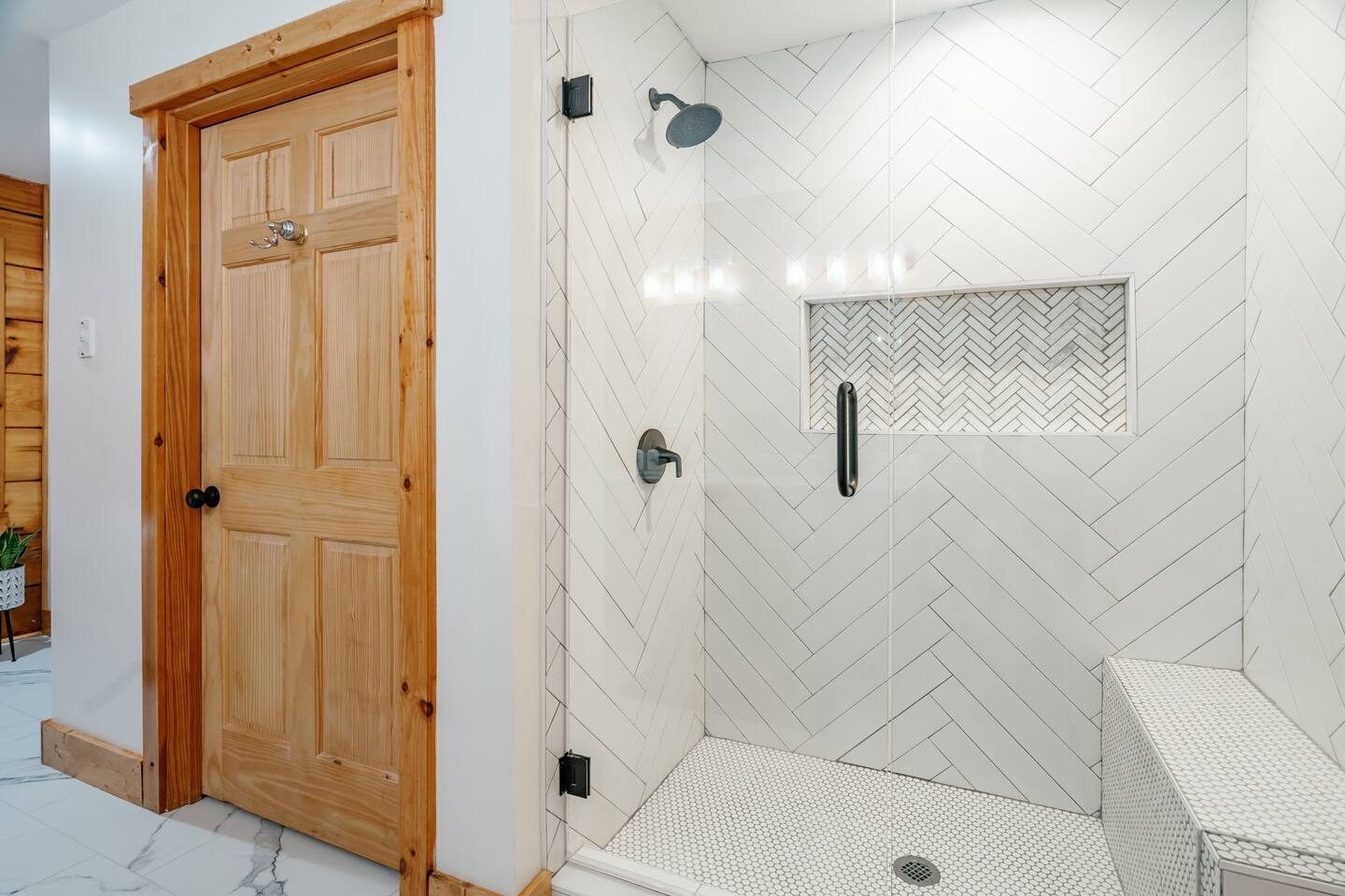 Large master bath shower with bench.