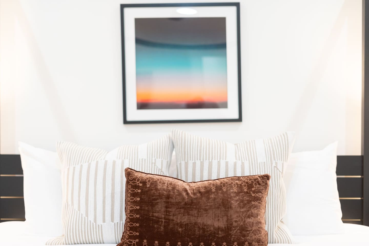 Warm accents and modern details create a relaxing and elegant bedroom atmosphere.