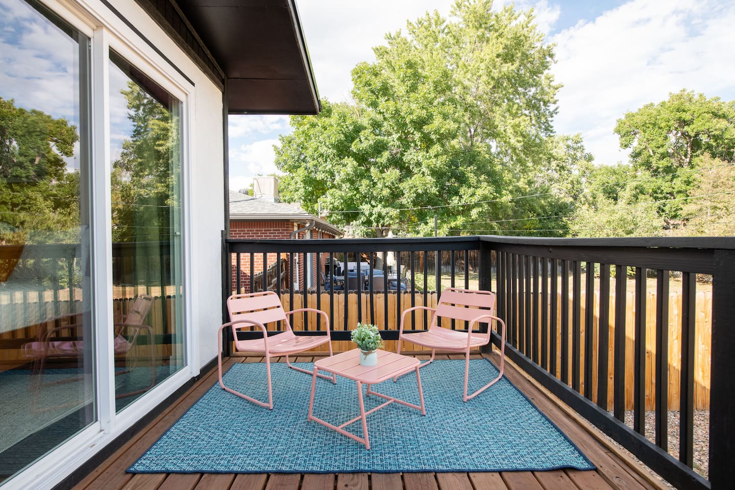 Spacious deck with seating and private fenced yard  to enjoy the morning sunshine and a cup of coffee on the patio. 