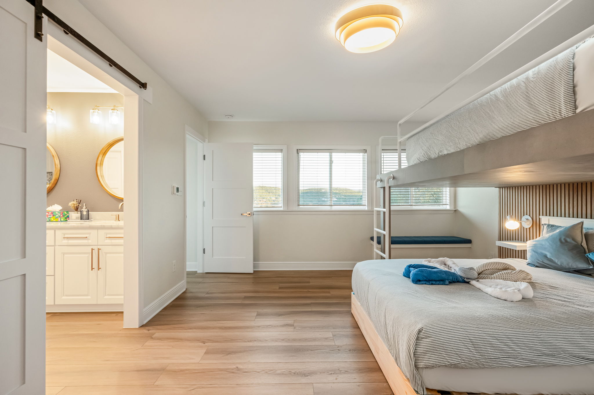 Another view of the versatile bunk bedroom with easy access to the nearby bathroom.