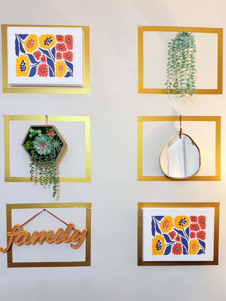 Boho-chic wall art and light neutral tones bring personality and style to this thoughtfully designed room. 