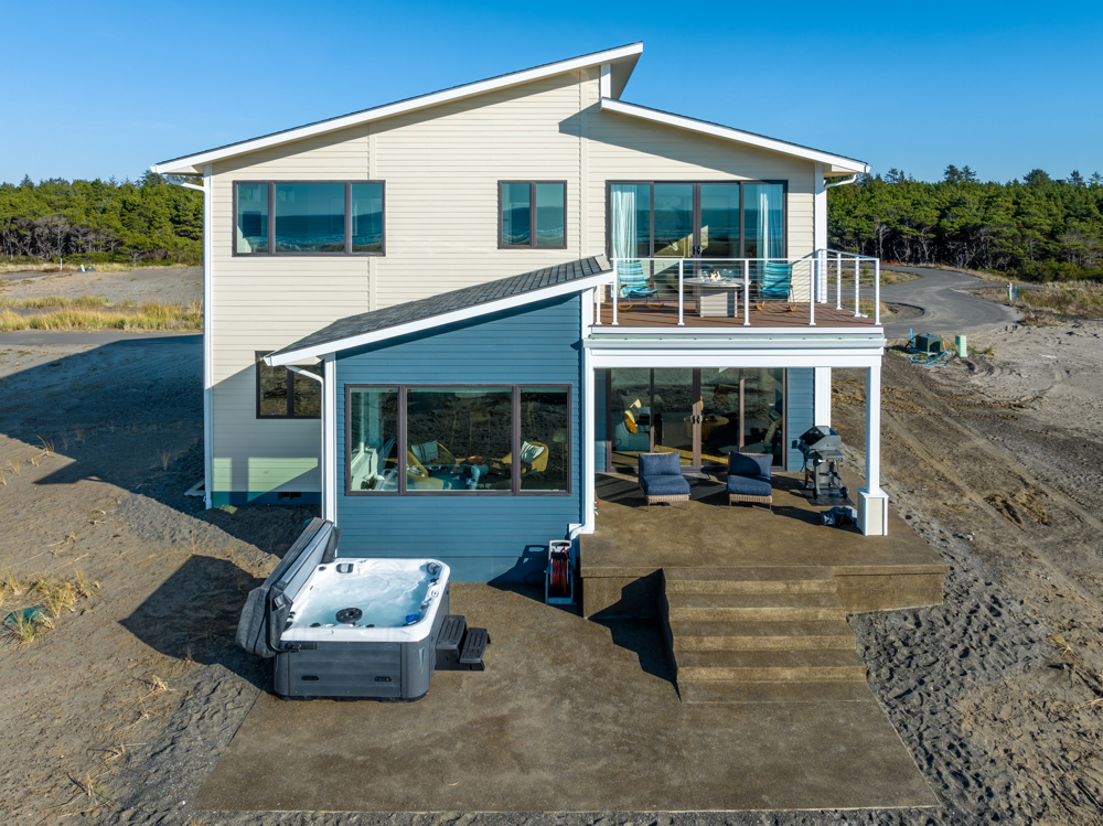 {Exterior] Private Oceanfront Hot Tub and Patio