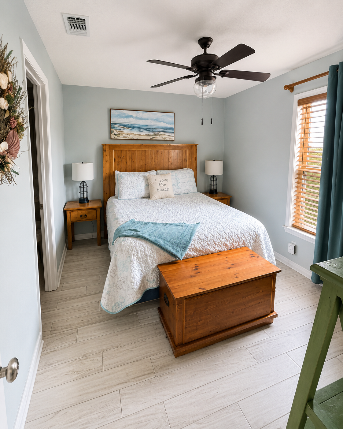 Cozy, peaceful bedroom with comfortable bedding-the perfect place to recharge after a day at the beach.