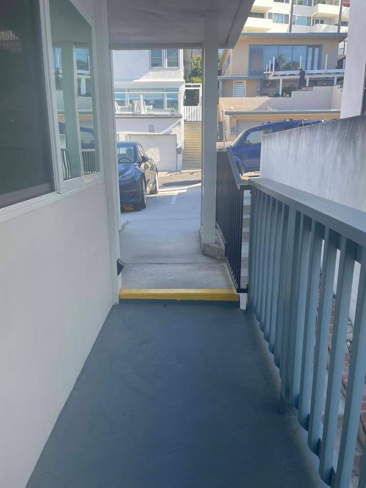 One 4.5 inch step up from condo to parking area.