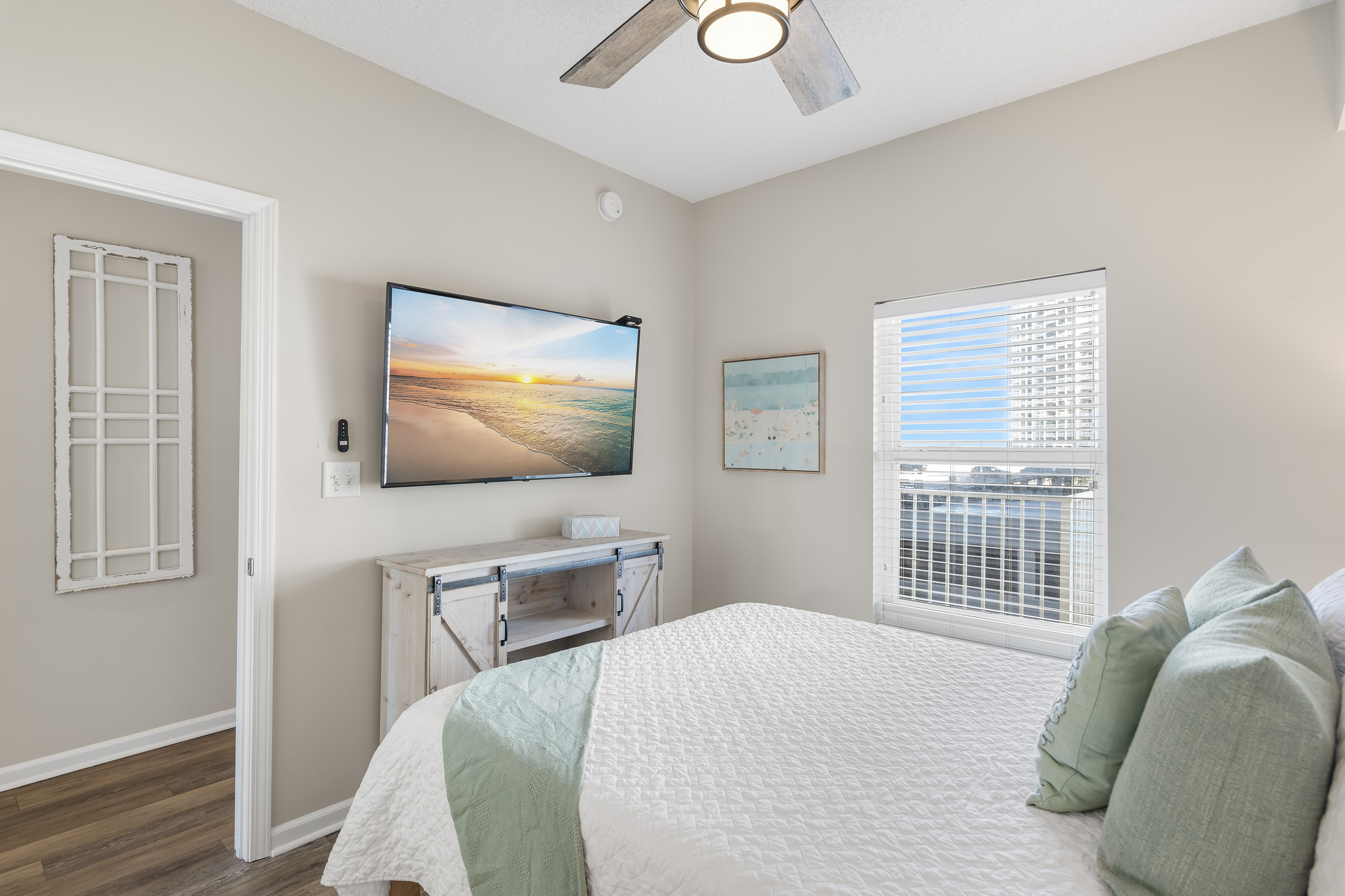 Guest Bedroom has Queen Bed + Twin Trundle, 55" Smart TV, attached closet, and attached bathroom with shower/tub combo