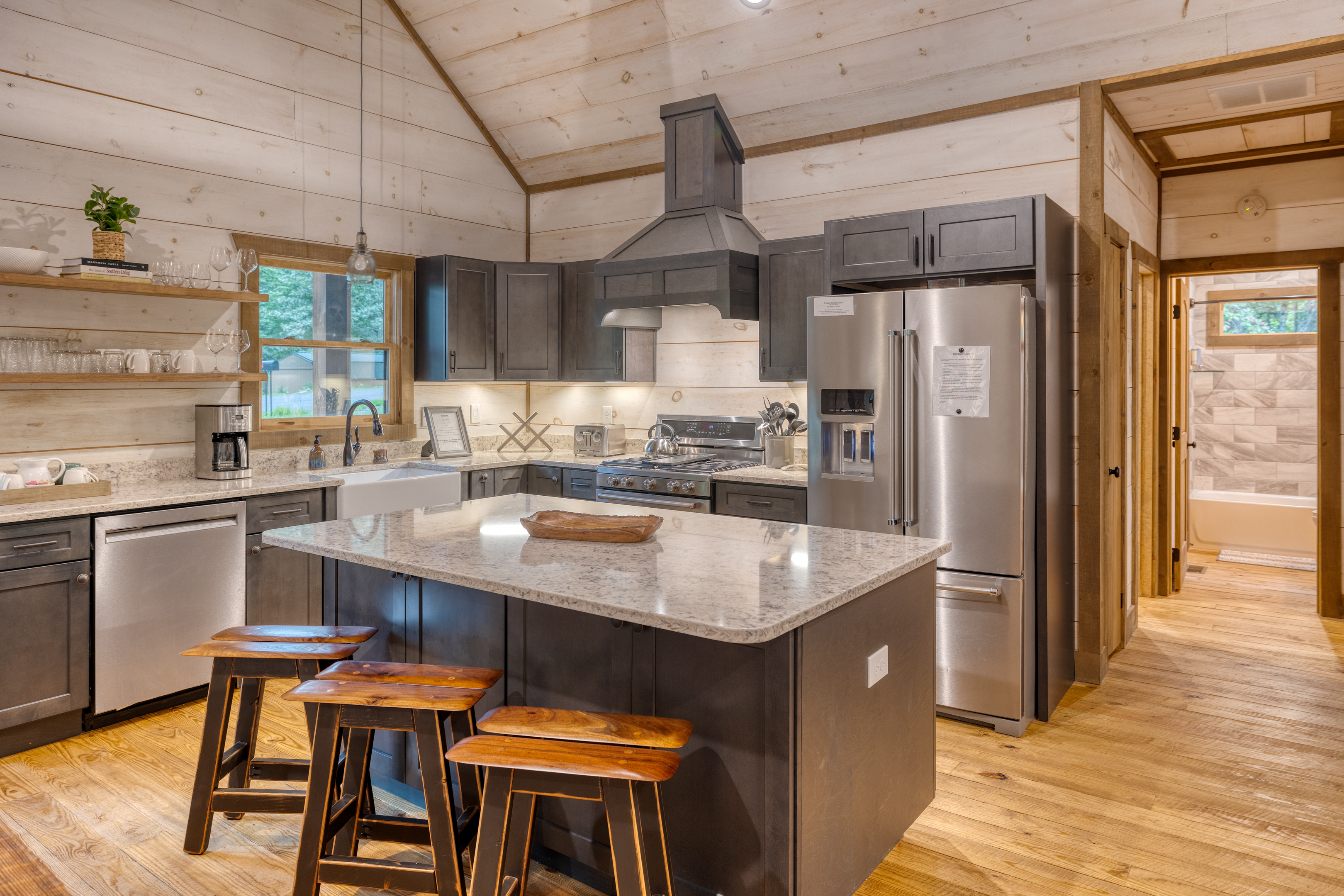 Modern well appointed kitchen for cooking and talking while preparing food.