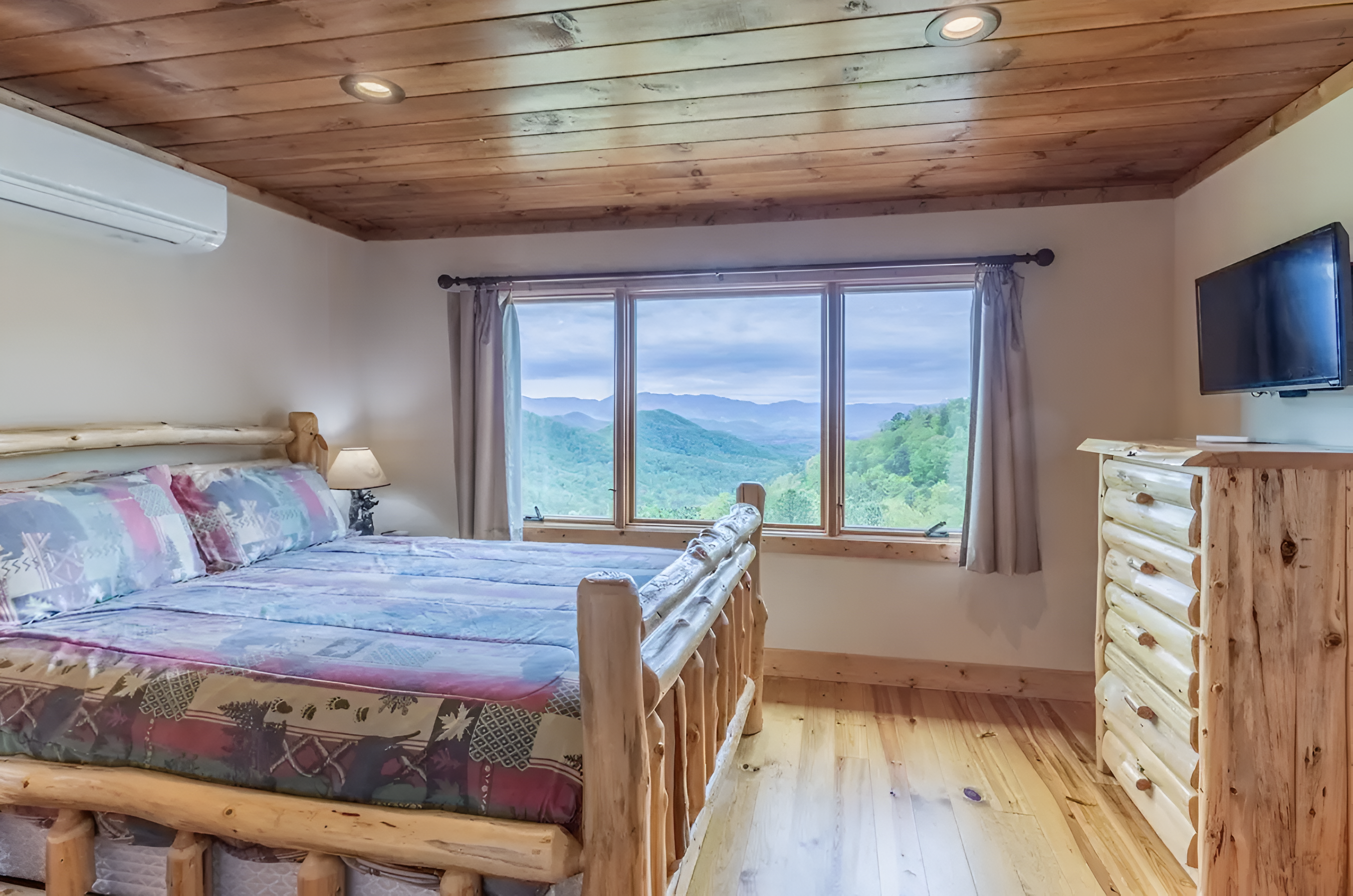 The upper level queen-sized bedroom has great views, a personal TV and ensuite bathroom.
