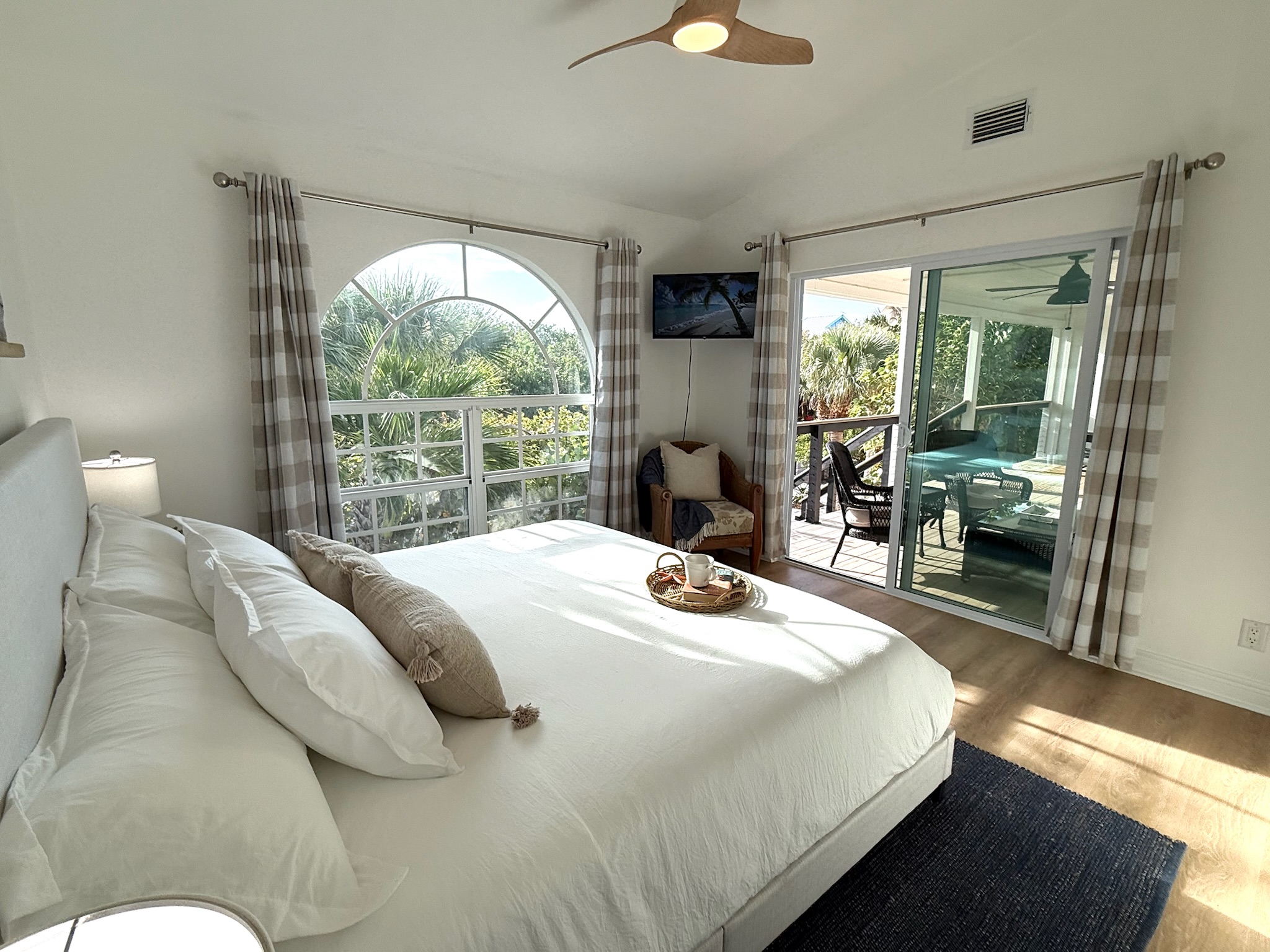 King bed, patio door opens to the large, comfortable front porch