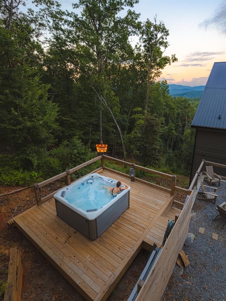 The hot tub deck is arranged for both privacy and views