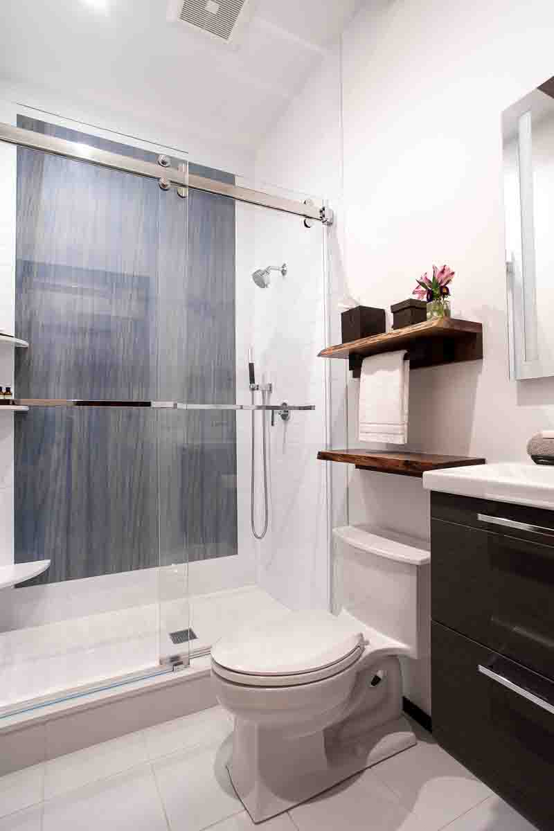 Ensuite bathroom with white tile and blue-stone shower accent wall &mdash; Sunset Falls Berkshires