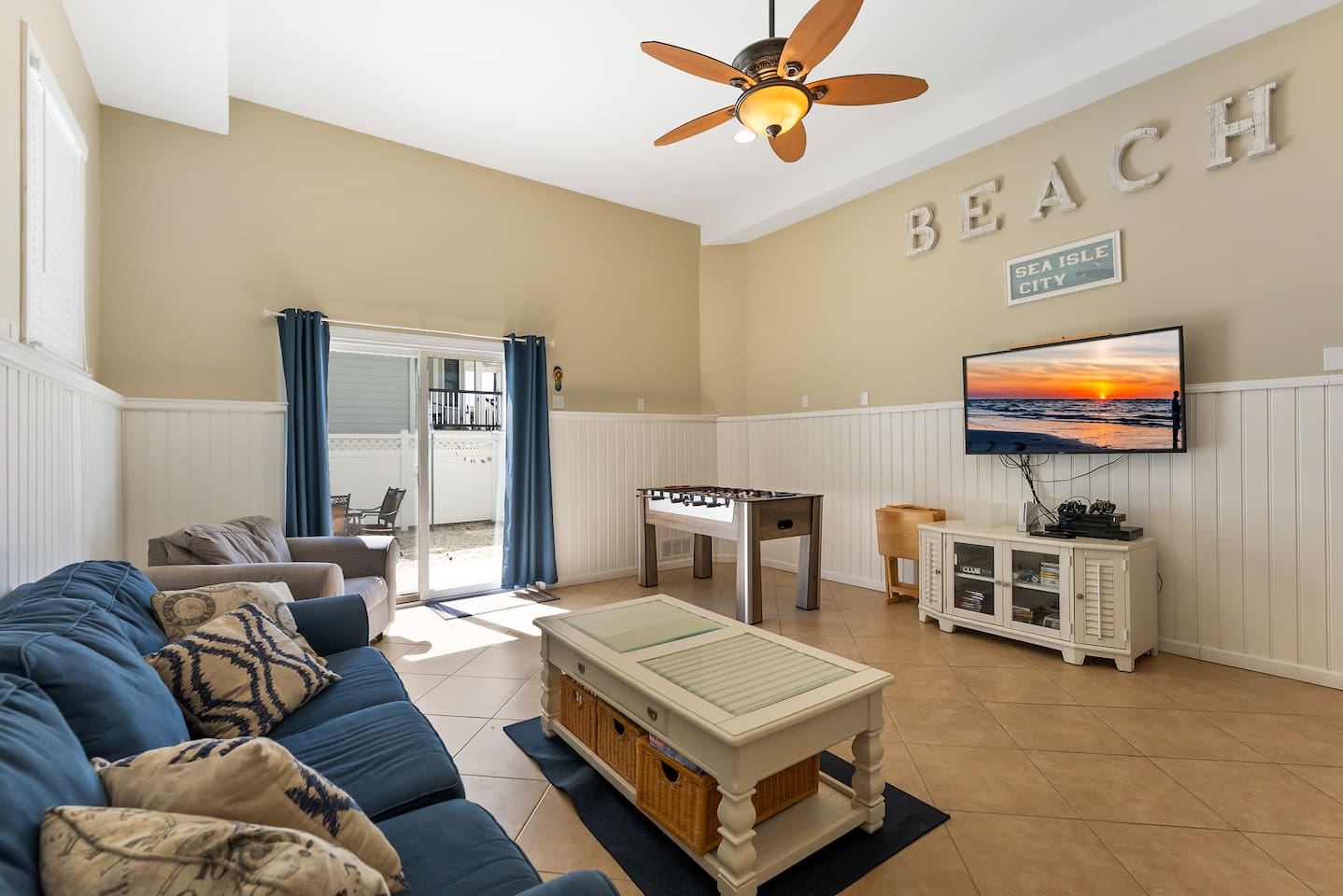 Bonus room with HDTV, Foosball Table, Bunk beds and ample seating for games and entertaining. With direct access to private fenced in yard featuring BBQ Grill. 