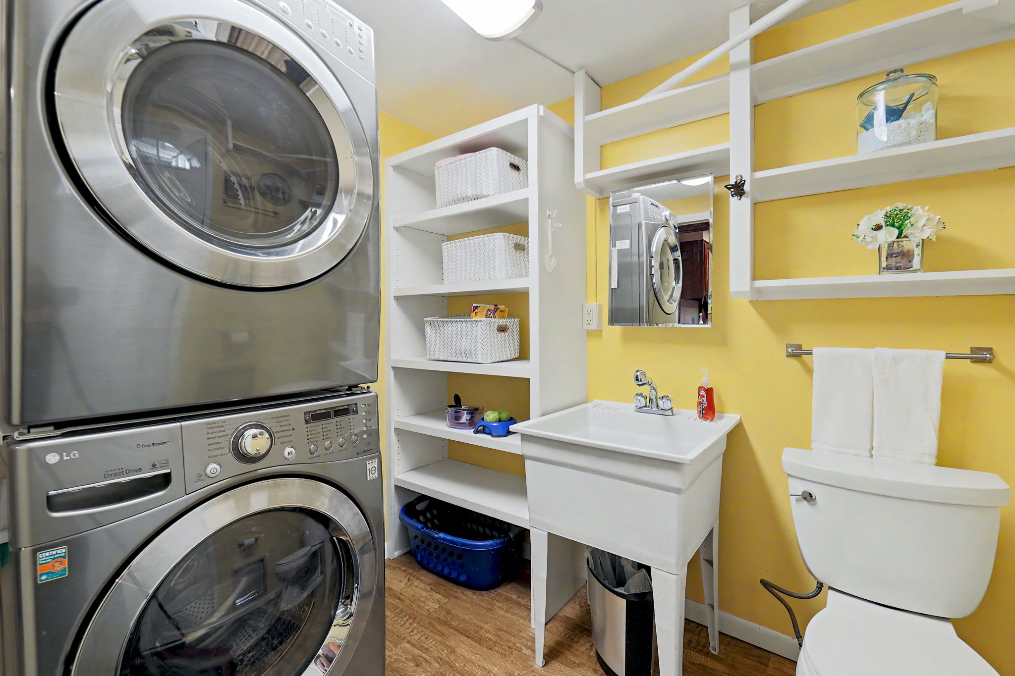 Laundry with 1/2 bath with access door to back yard