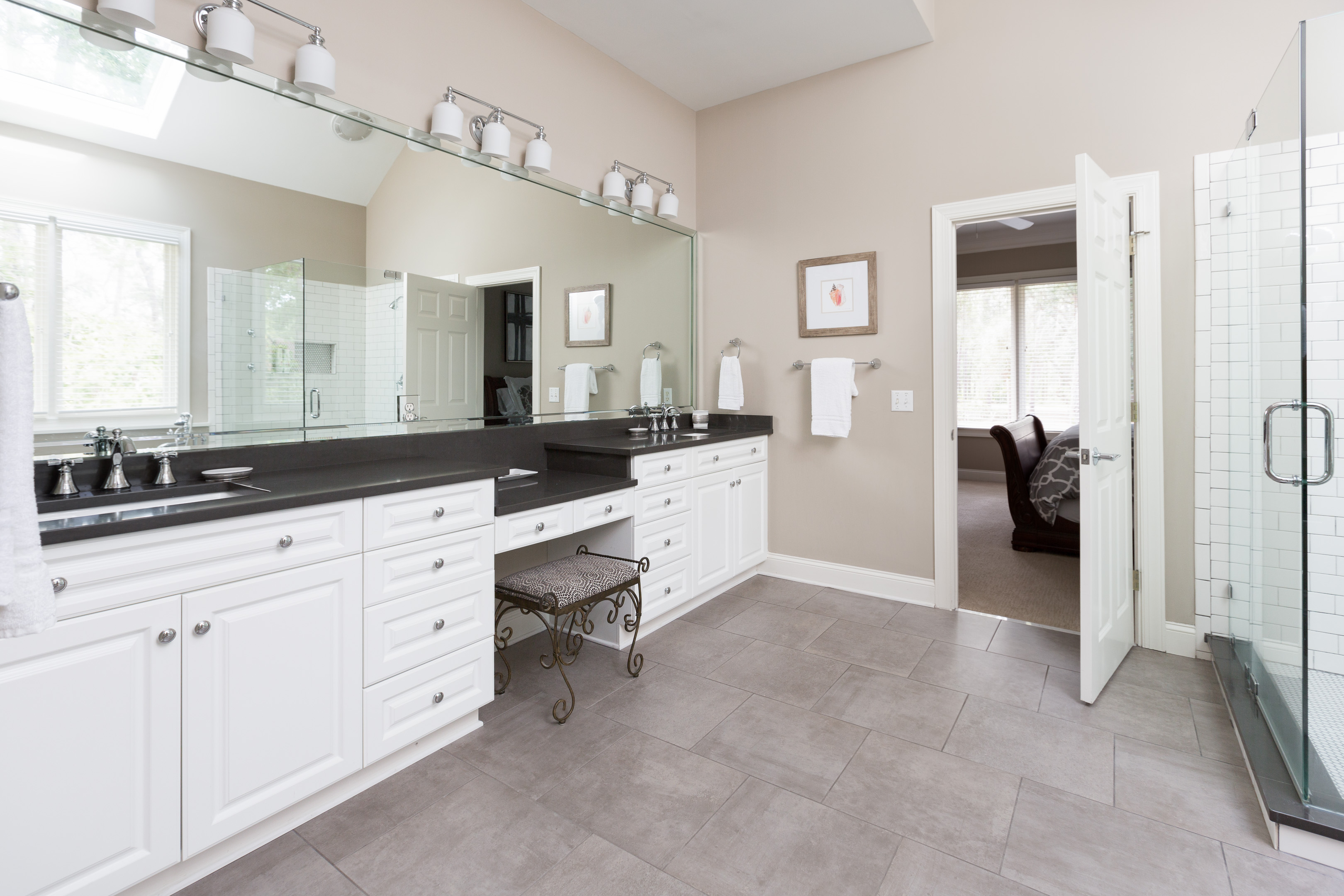 Primary bath double vanity featuring beautiful quartz counter tops