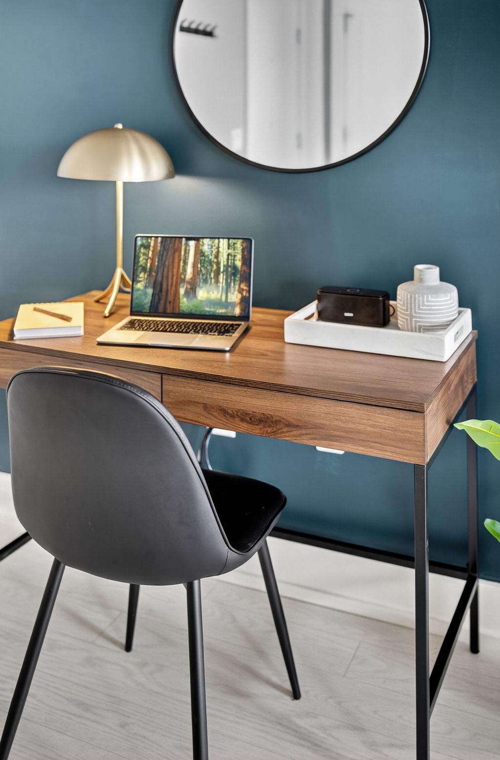 Clean and modern workstation with soft seating, minimalist decor, and a welcoming vibe for work or journaling.