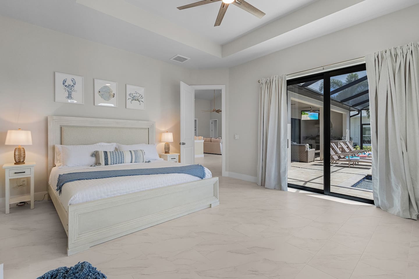 2nd primary bedroom with a king-size bed and direct access to the pool and spa area, offering the perfect blend of luxury and relaxation!