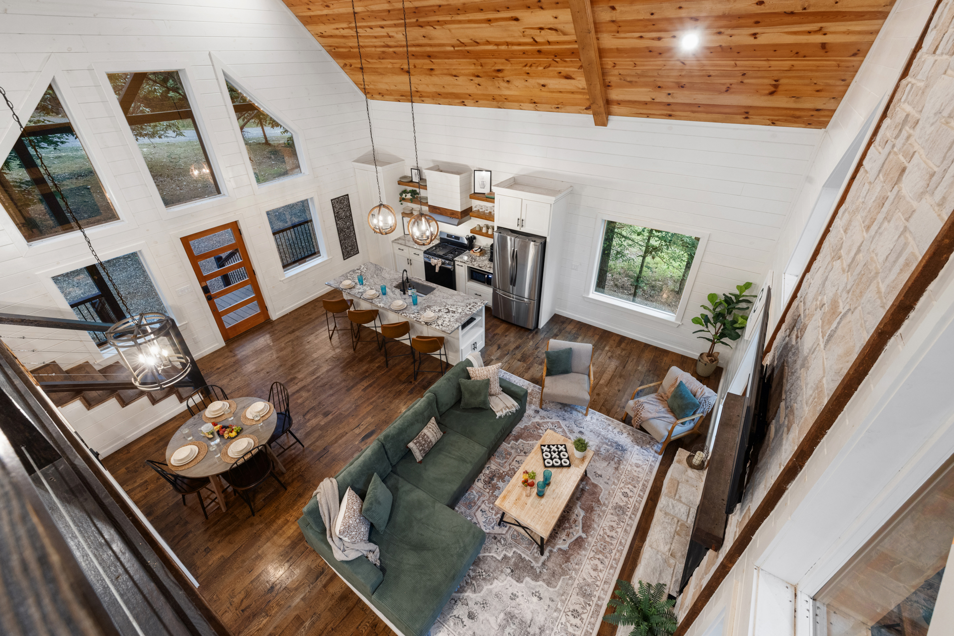 A bird’s eye view of where cabin memories are made.
Living room comfort with a little extra breathing room. 
Open, inviting, and wrapped in warm cabin charm, this is the kind of space where everyone naturally ends up together.