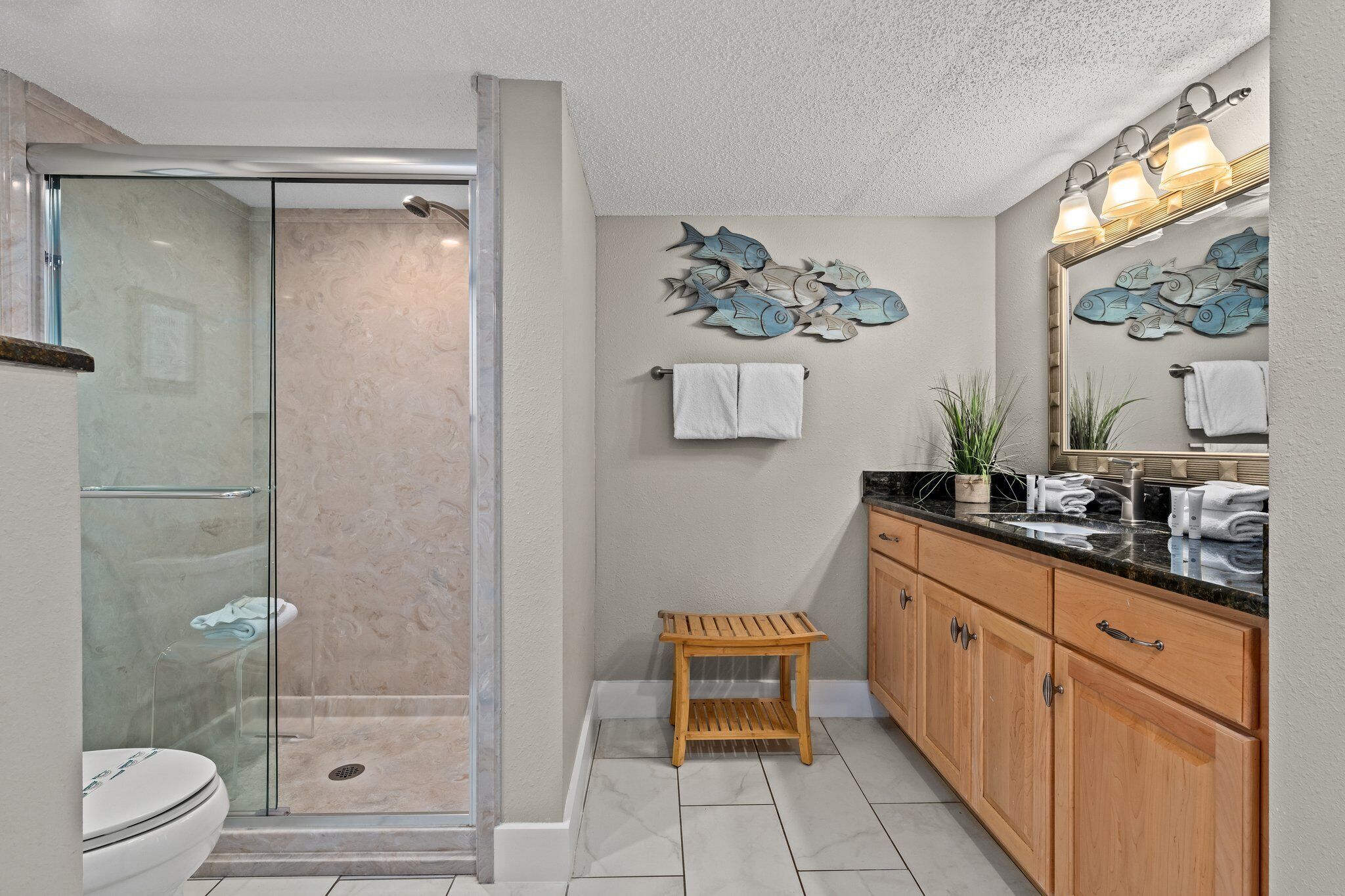 Ensuite bathroom leading into the primary gulf front bedroom