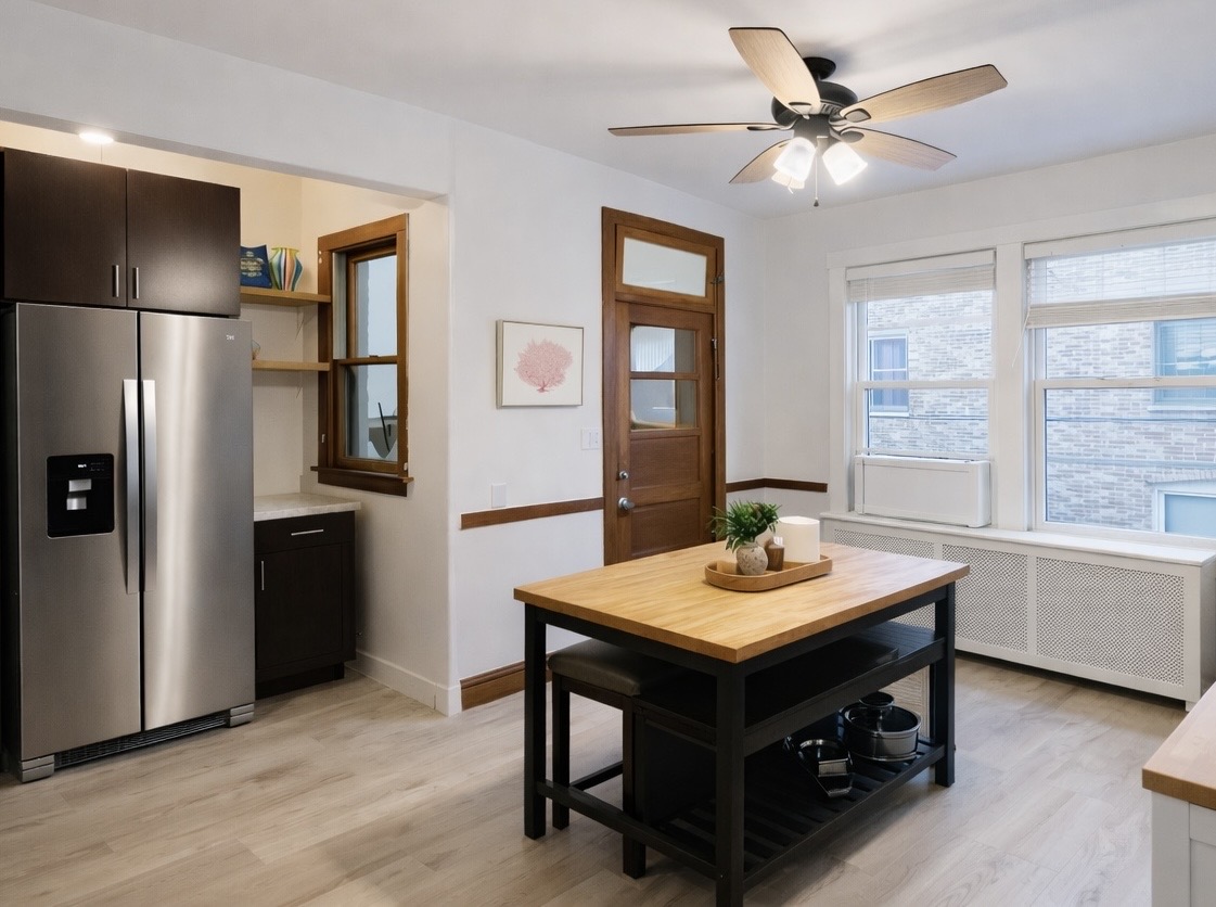Bright, spacious and fully equipped kitchen with island seating — perfect for cooking, coffee, and gathering.