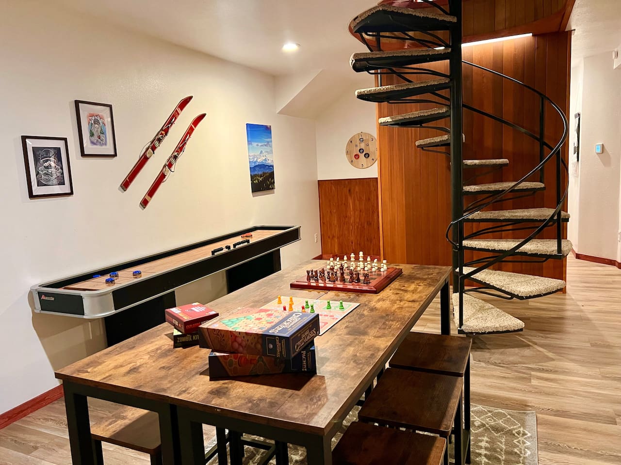 Mount Hood and Winter Sports Themed Game Room with Wood Burning Fireplace and Large Smart TV.