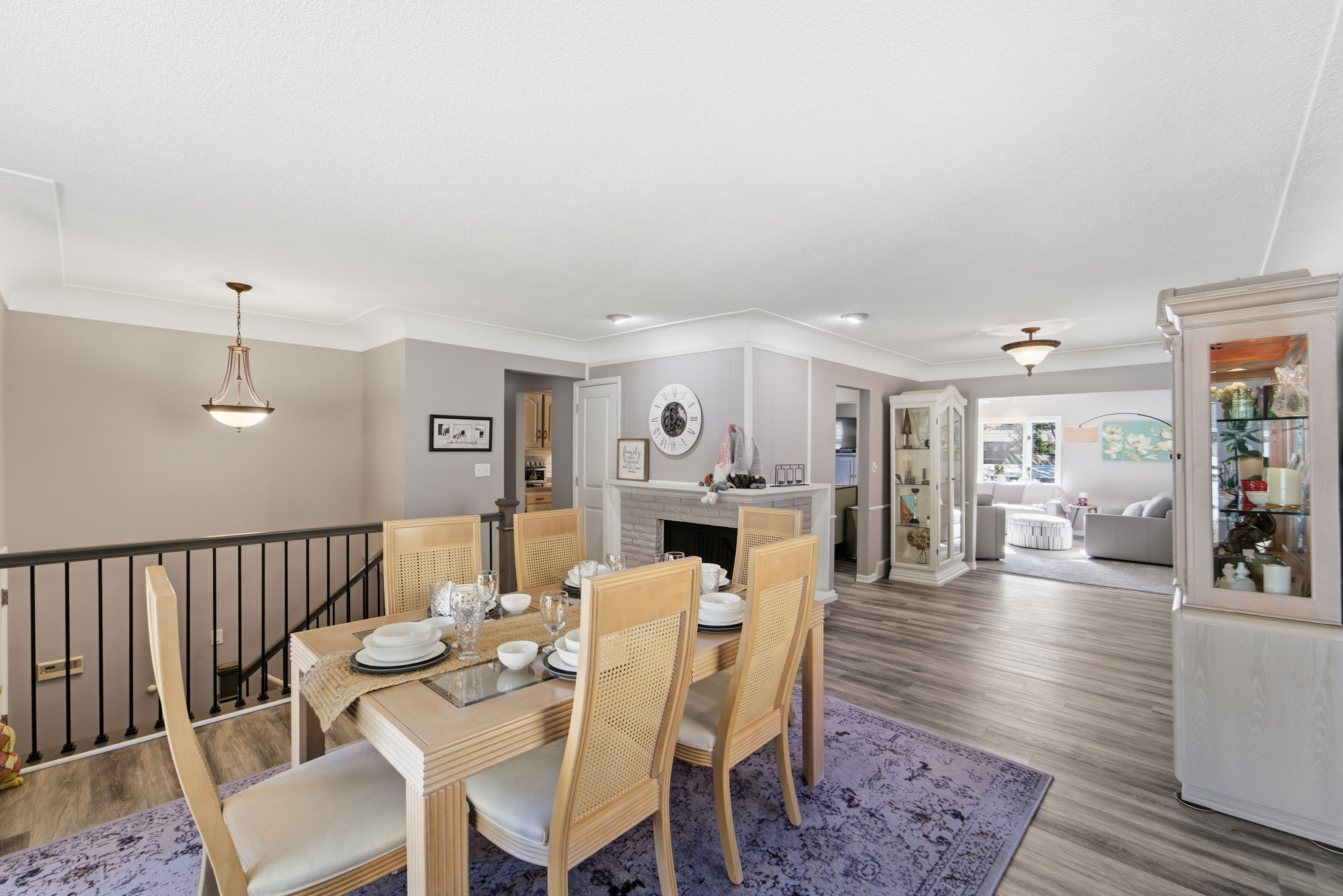 Dining table is set up for 6 seats, with a table leaf and extra chairs, this dining space can seat 8-10.