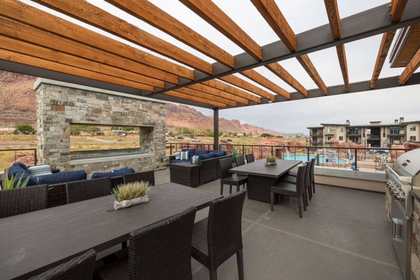 Outdoor dining with breathtaking views of the pool and red rocks.