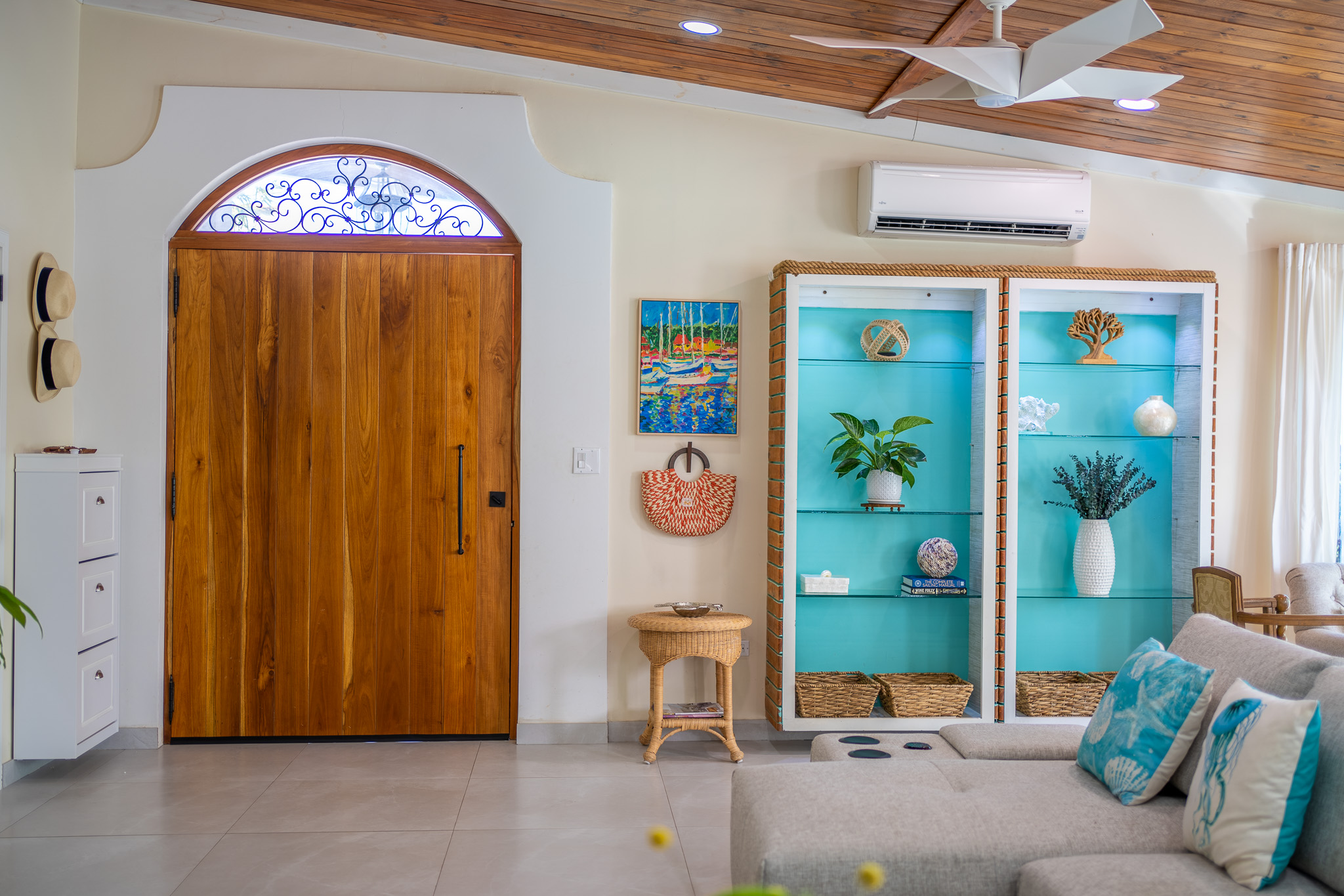 A look back from the kitchen through the living room to the front custom teak door in Dorado, Puerto Rico.