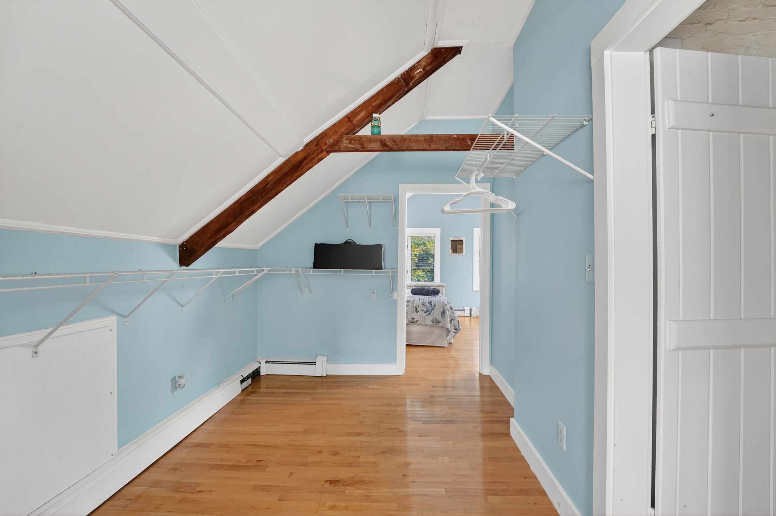Open loft area offering additional living space, perfect for relaxing, reading, or accommodating your group's needs.