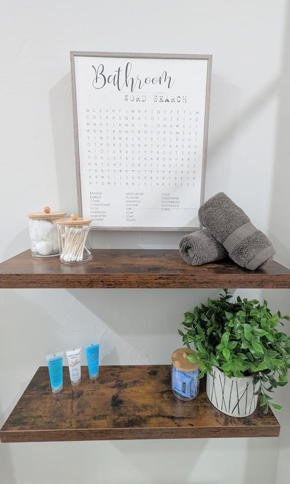 Easy to access toiletries include travel shampoo, conditioner, and lotion, cotton swabs, cotton balls, and makeup remover wipes. 