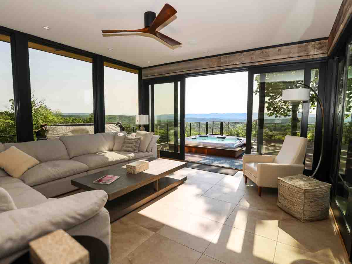 Sunroom at Sunset Falls &mdash; west light, valley view, hot tub deck beyond