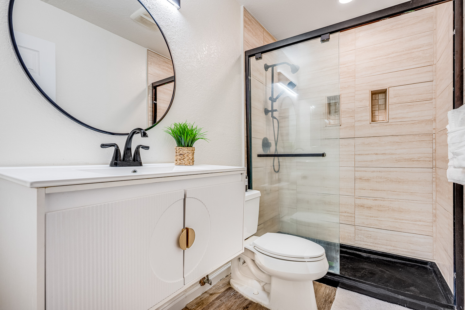 Elegant, modern bathroom with walk-in glass shower