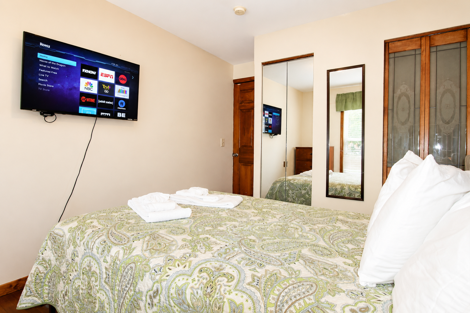 Bedroom #1 with a 43" (or larger) wall mounted flat screen smart Roku TV