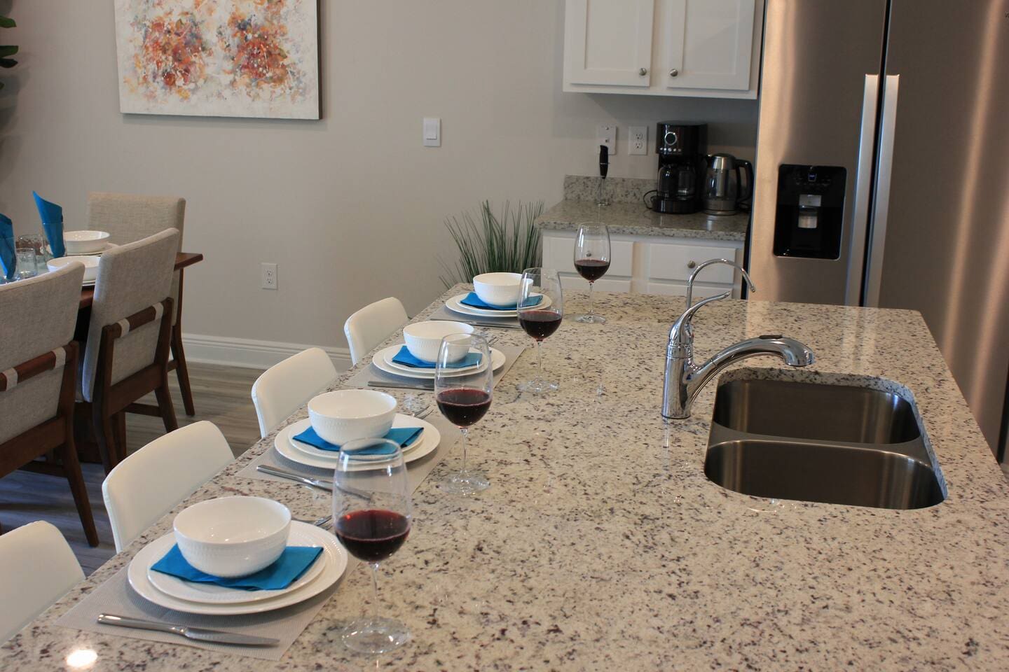 Bright, functional kitchen with dining area, modern appliances, and a convenient coffee maker.